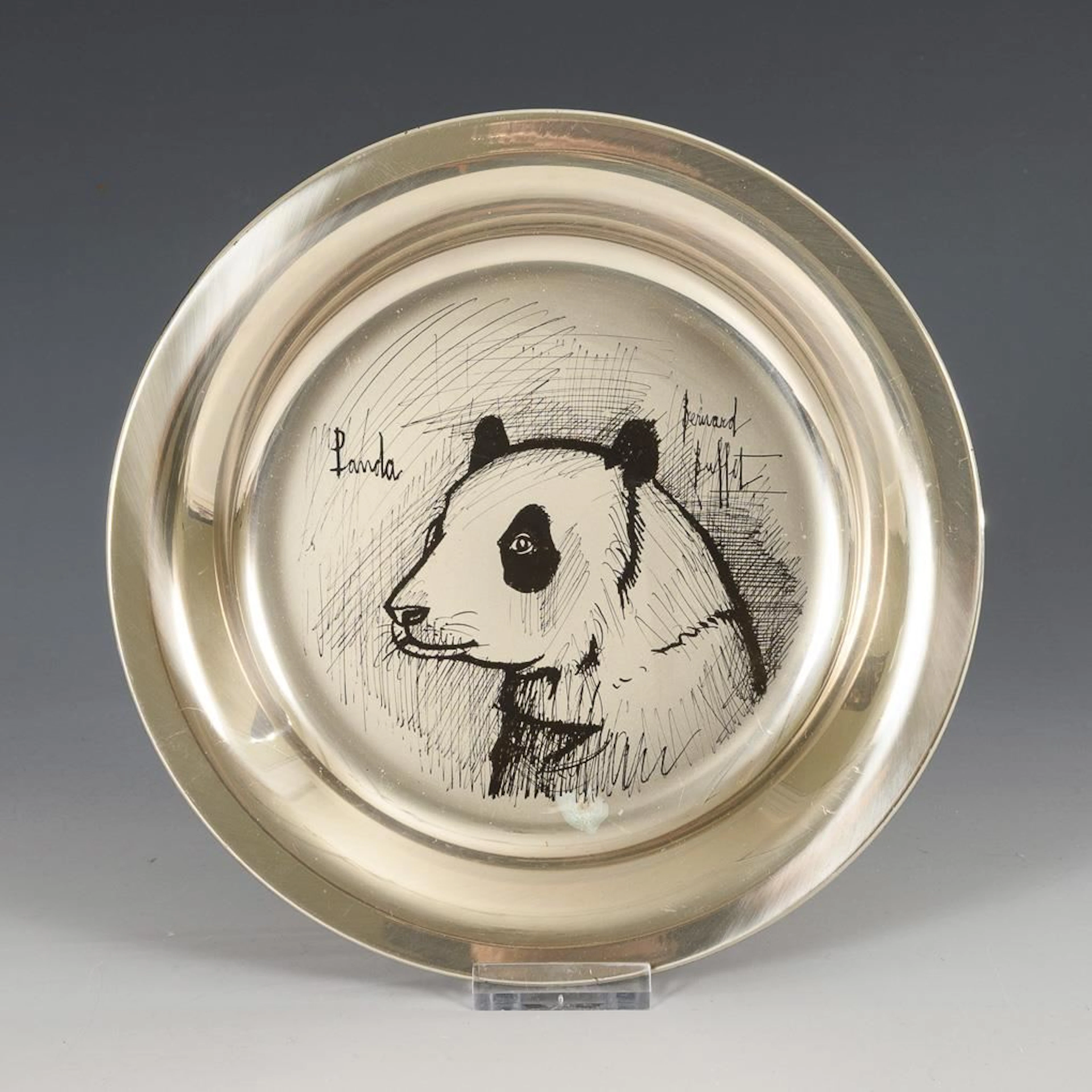 Silver collector's plate with a panda motif inspired by Bernard Buffet.