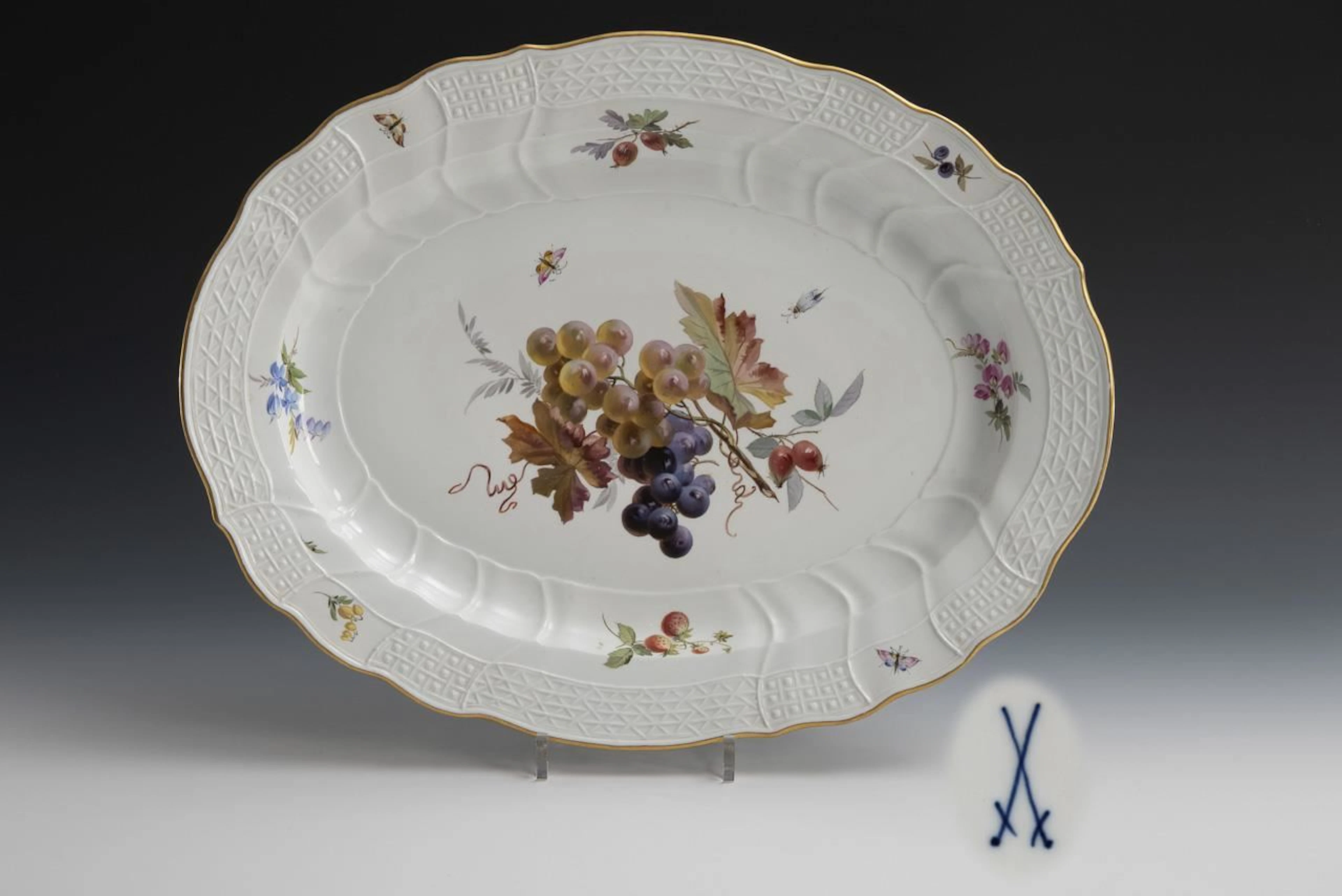 Large plate with fruit and insect motifs. Meissen.