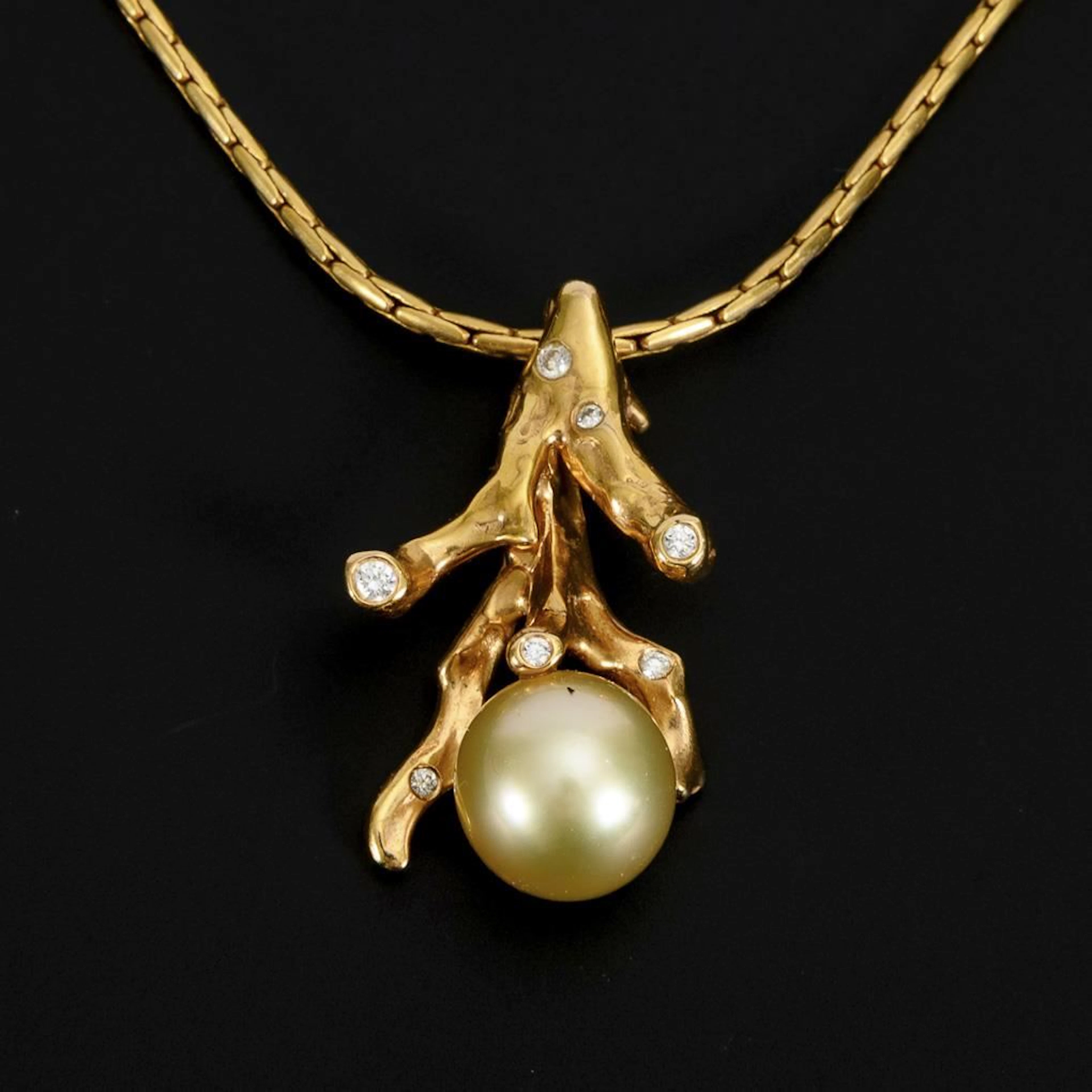 Coral-shaped pendant with a pearl on a chain.