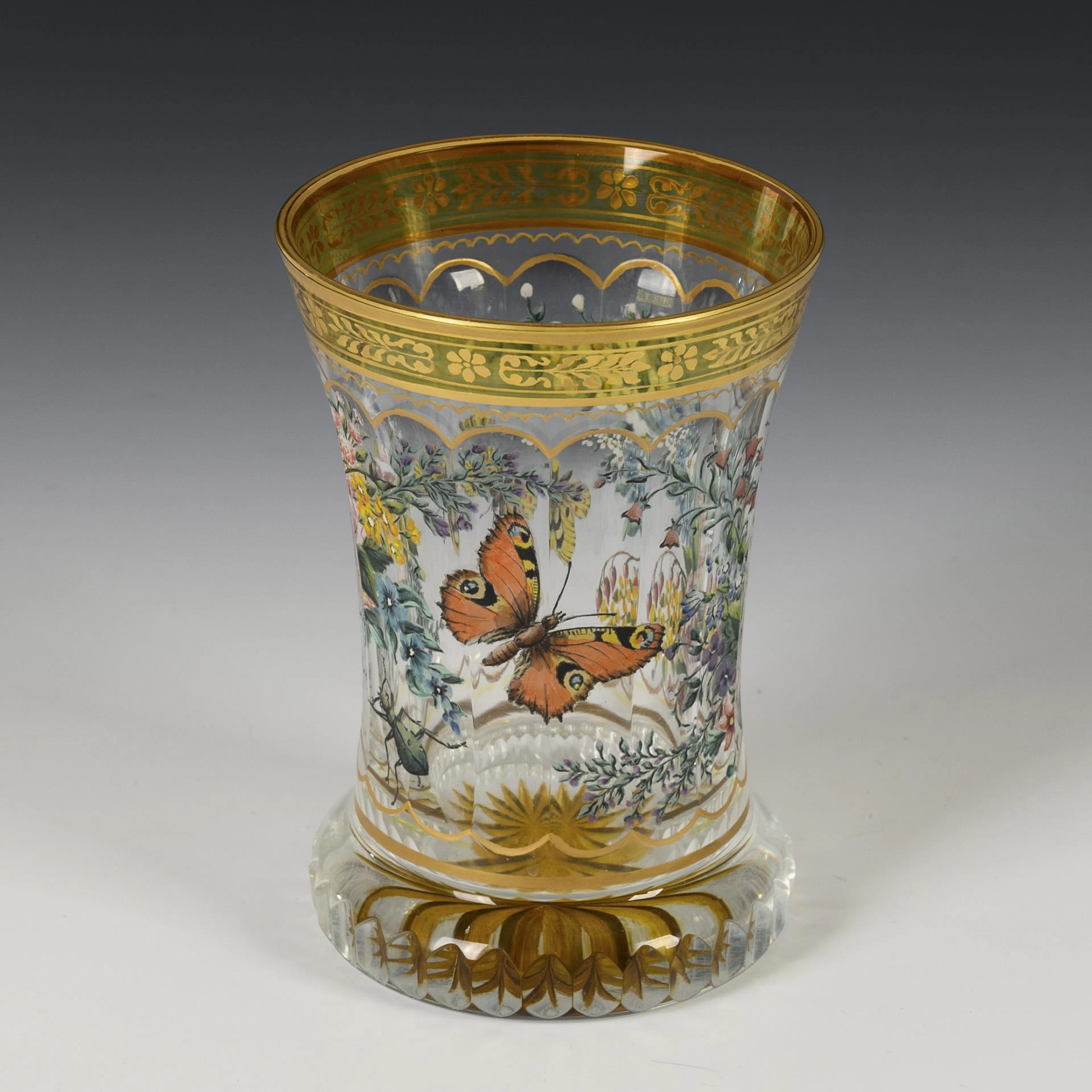 Cup with flower and butterfly painting.