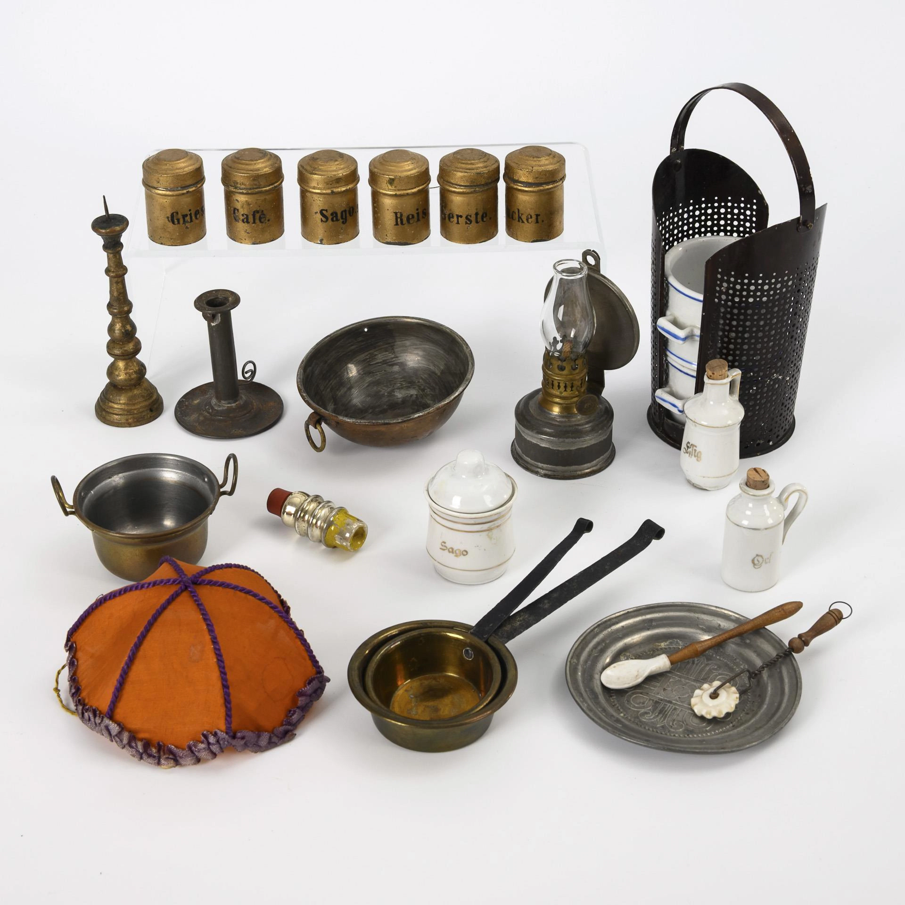 A collection of doll's house and kitchen accessories.