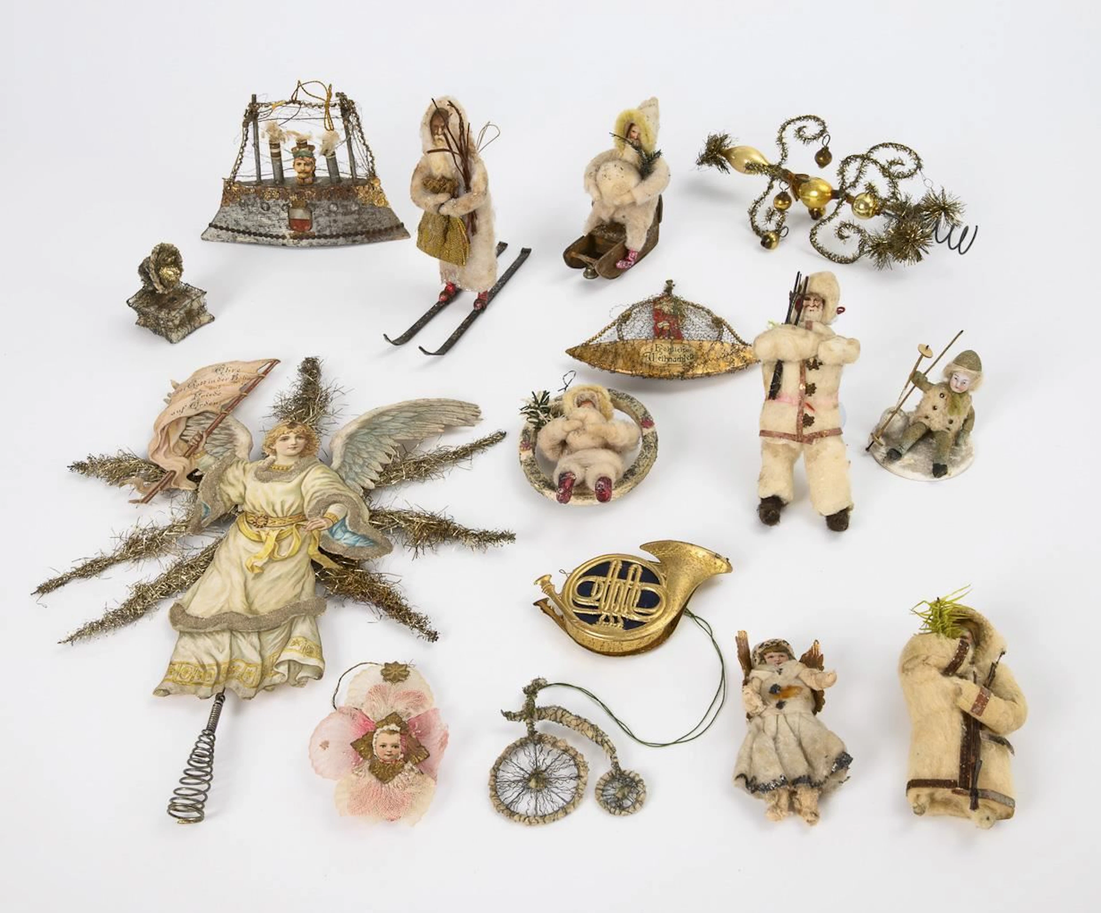 Assortment of old Christmas tree ornaments including cotton-stuffed