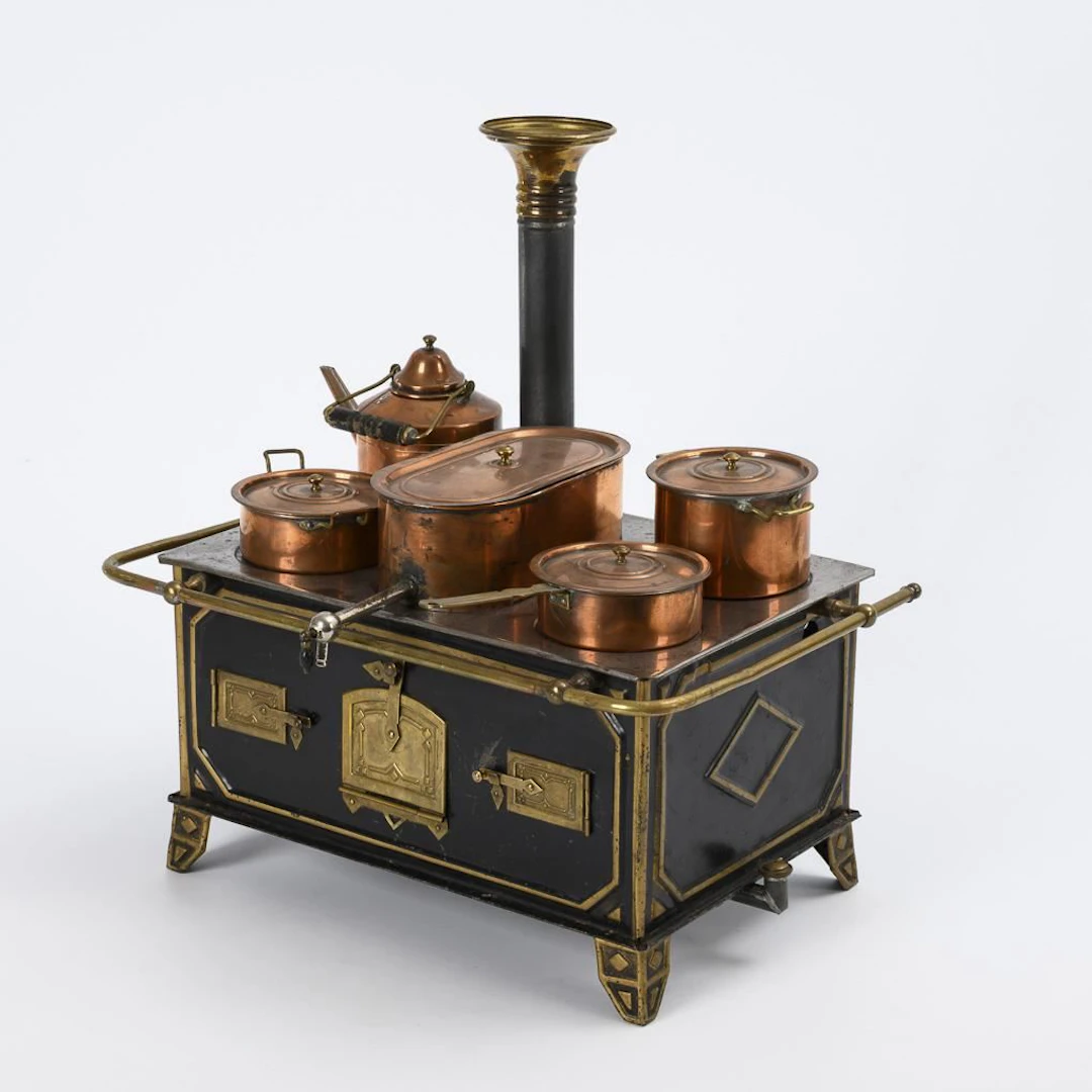 Tin stove with copper pots.