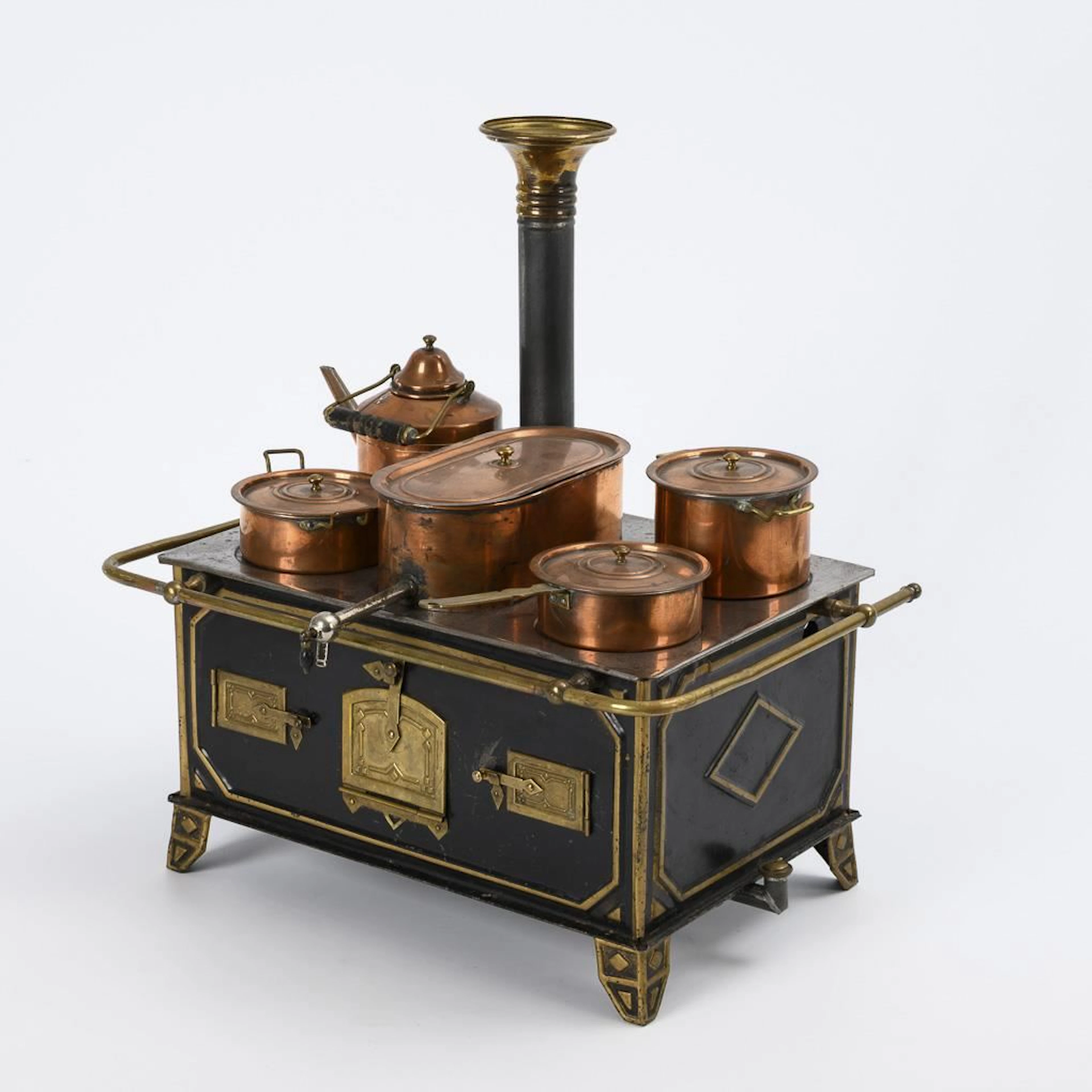 Tin stove with copper pots.