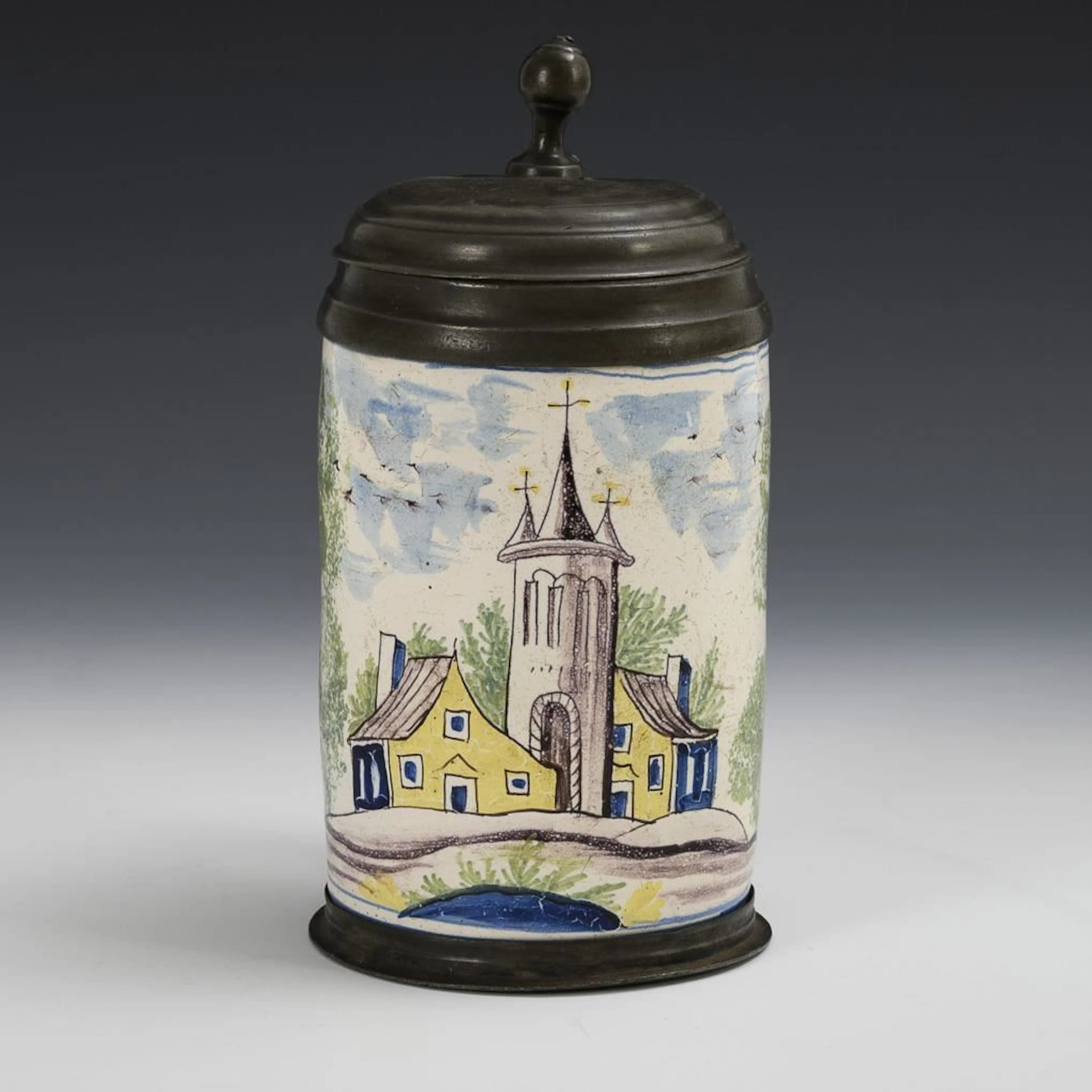 Faience cylindrical jug.