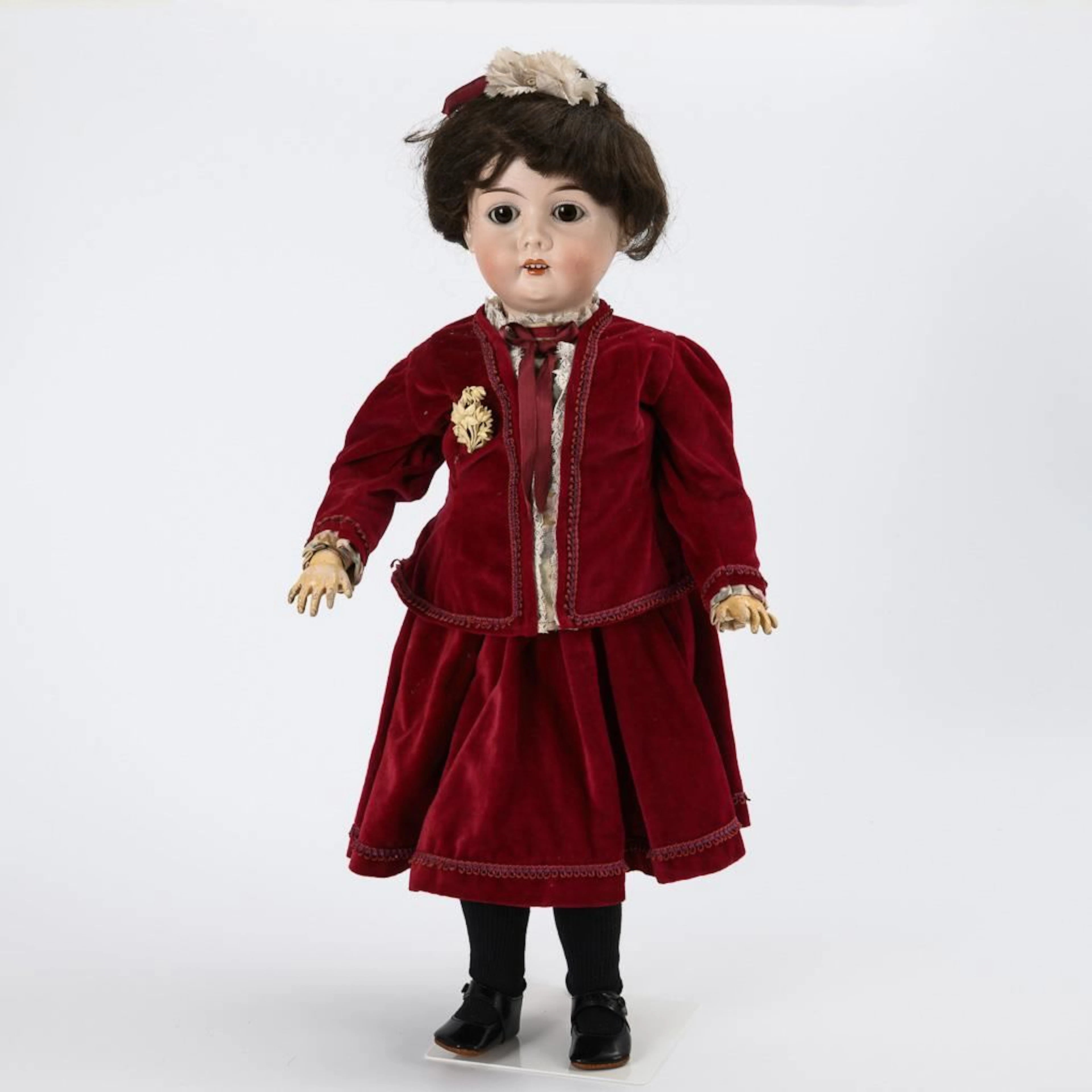 Girl's doll in a red velvet dress. Kühnlenz Brothers.