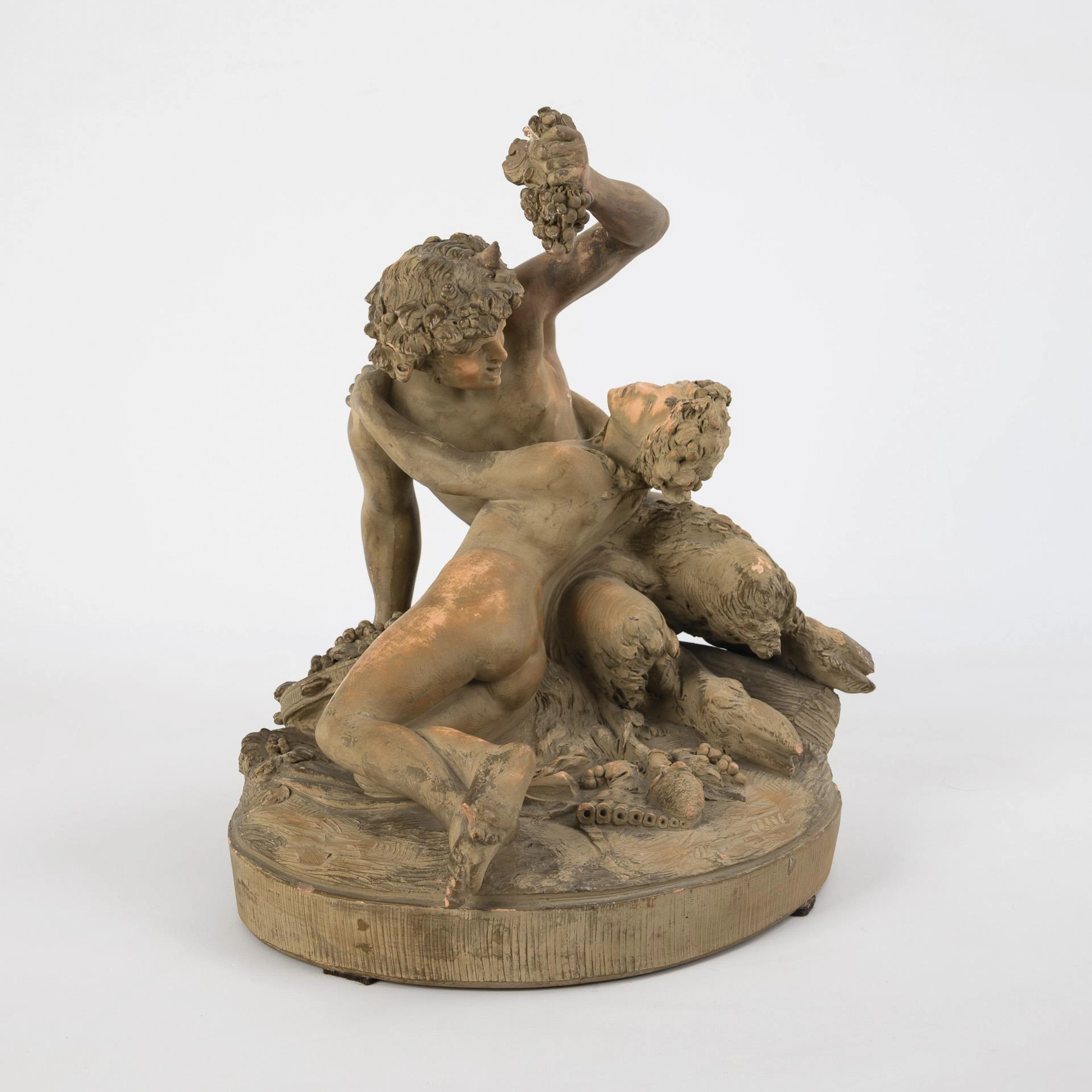 Terracotta figurine group: Bacchante scene.