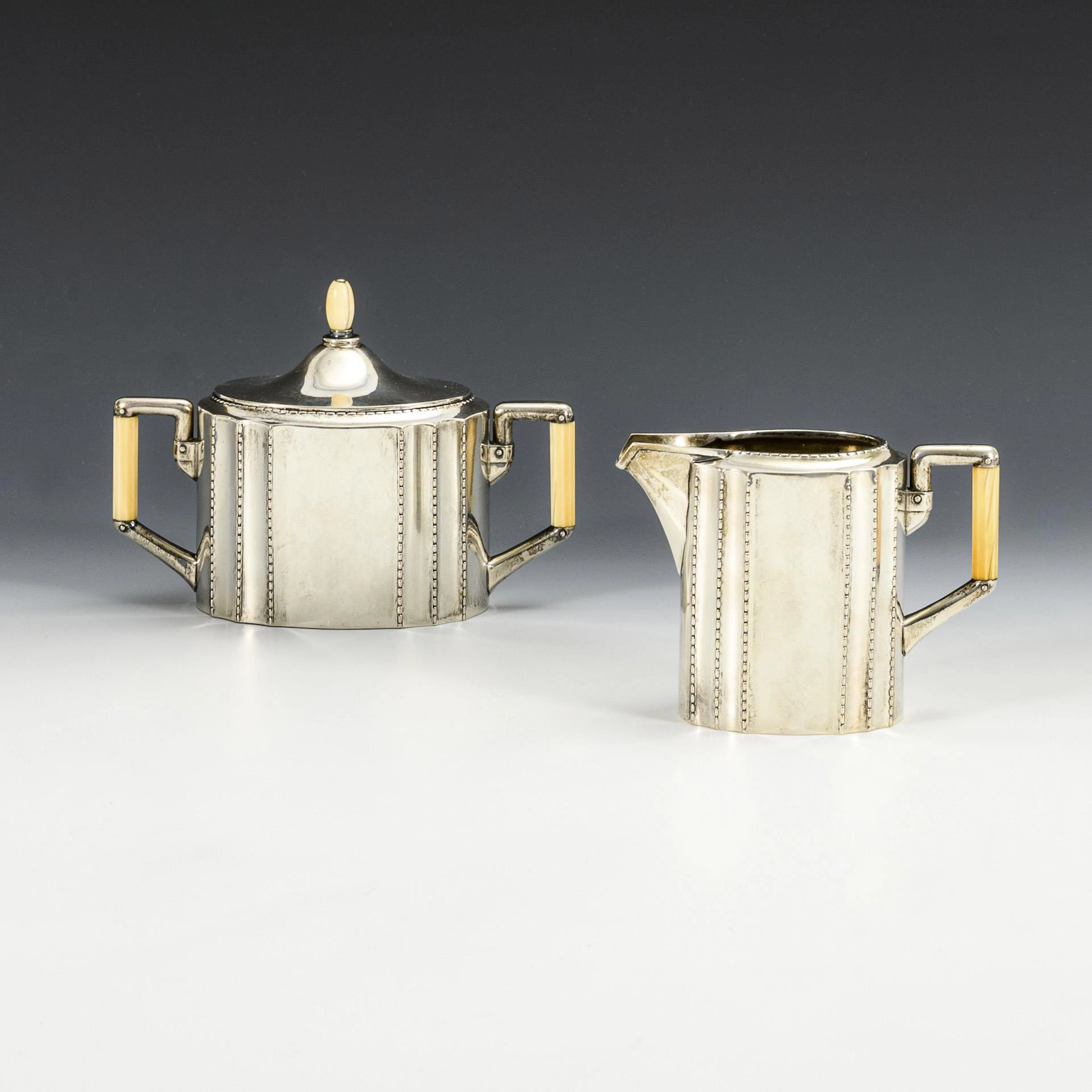 Sugar bowl and cream jug. Bremer silverware factory.