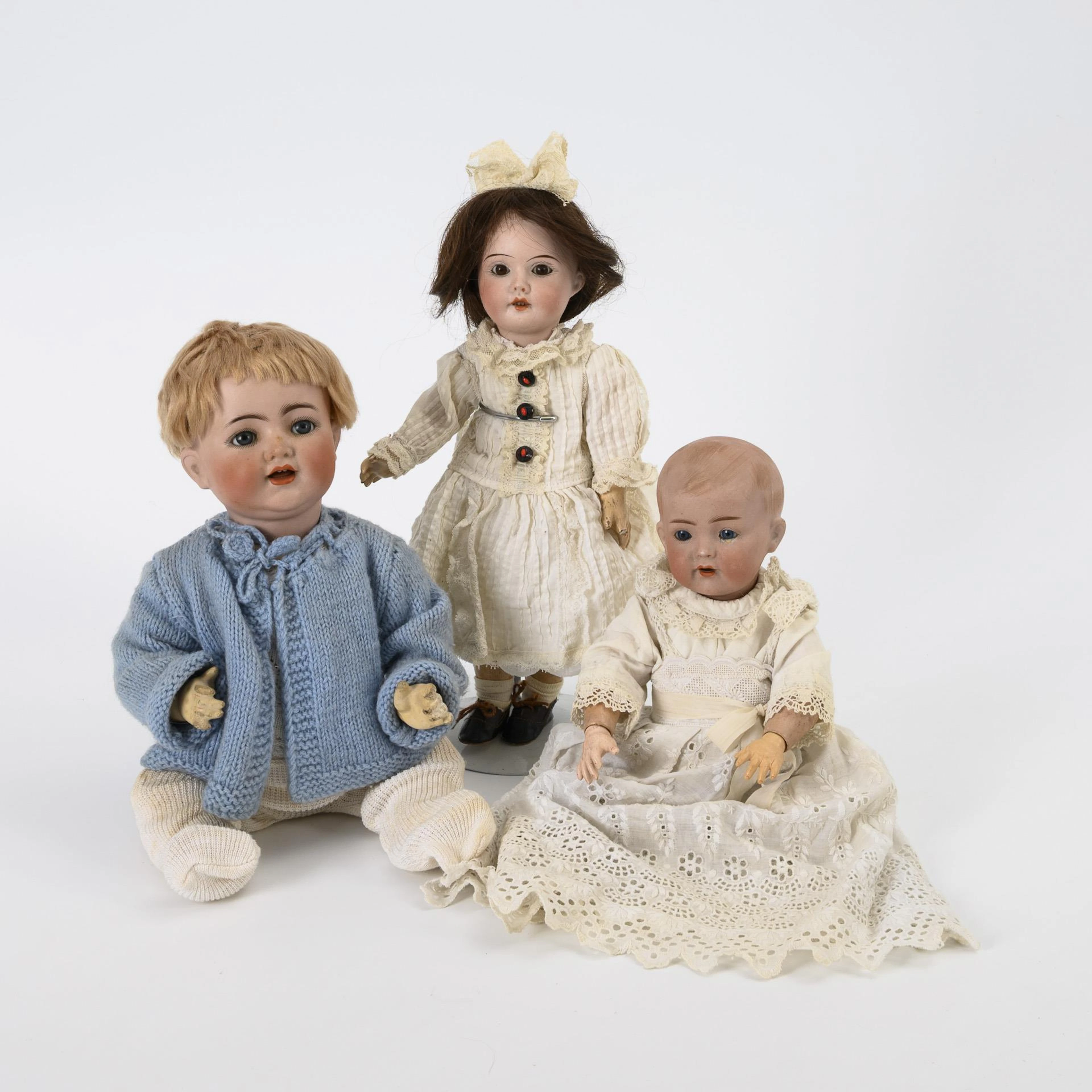 3 porcelain head dolls.