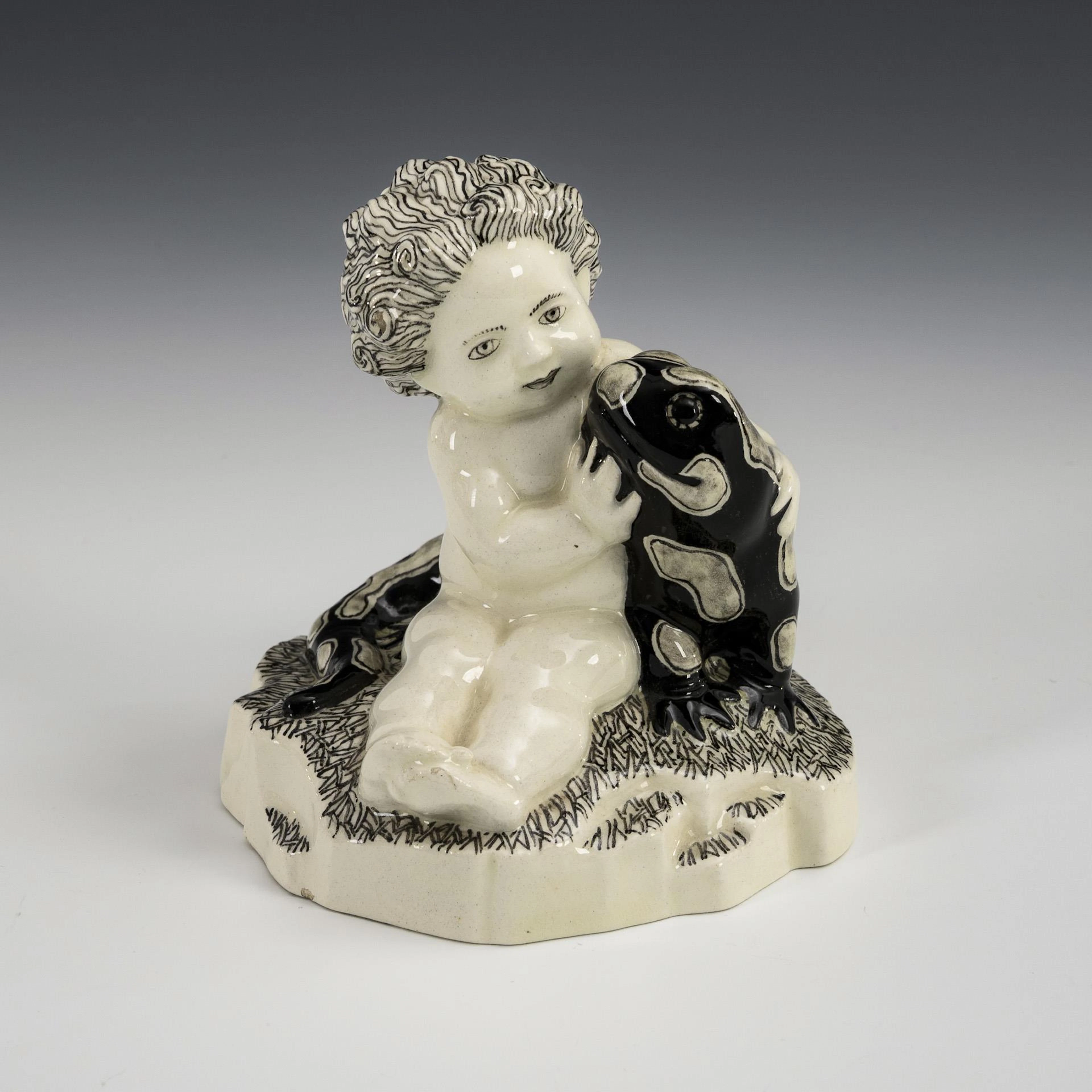 Small Art Nouveau putto with fire salamander. Viennese ceramics.
