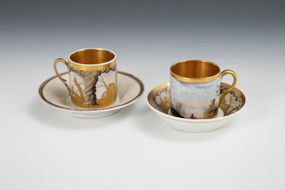 2 Empire-style cups with landscape paintings.
