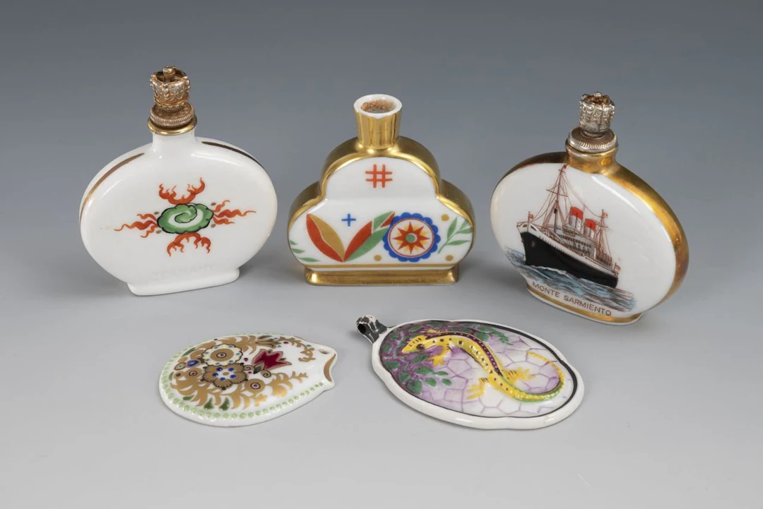 3 perfume bottles and 2 pendants.