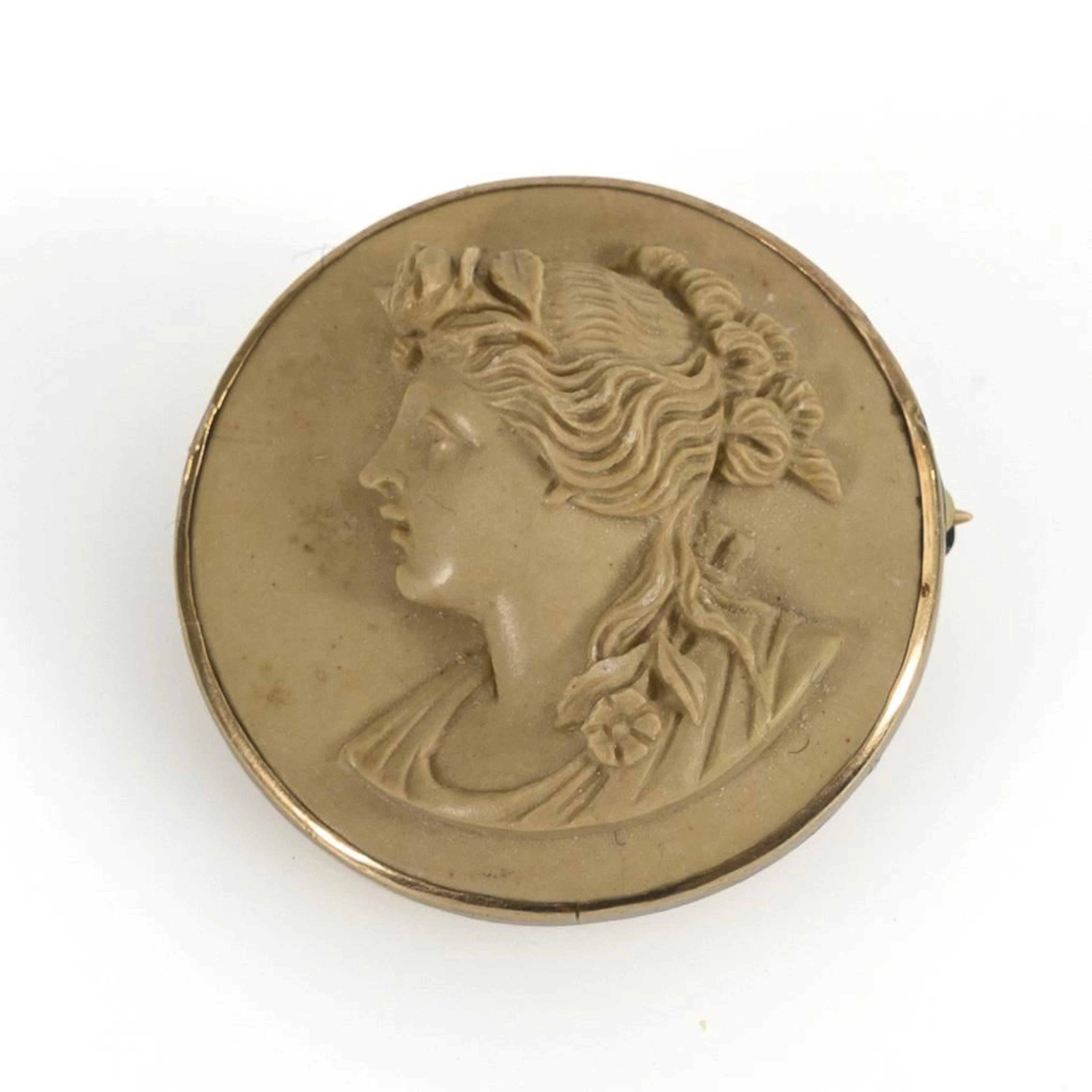 Historic brooch with a lava stone cameo.