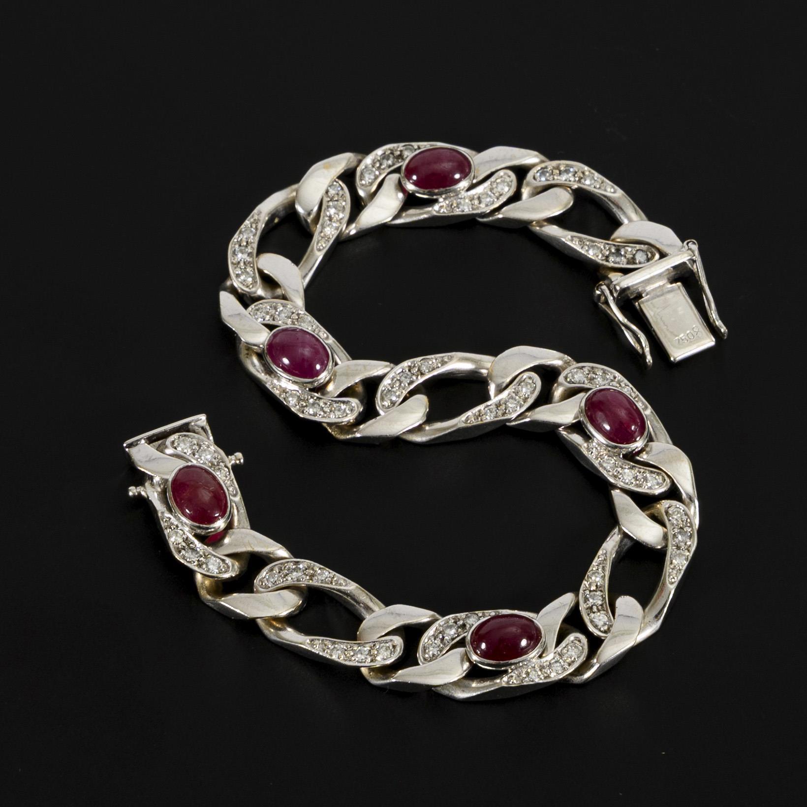 Bracelet with red colored stone cabochons, probably rubies, and diamonds.