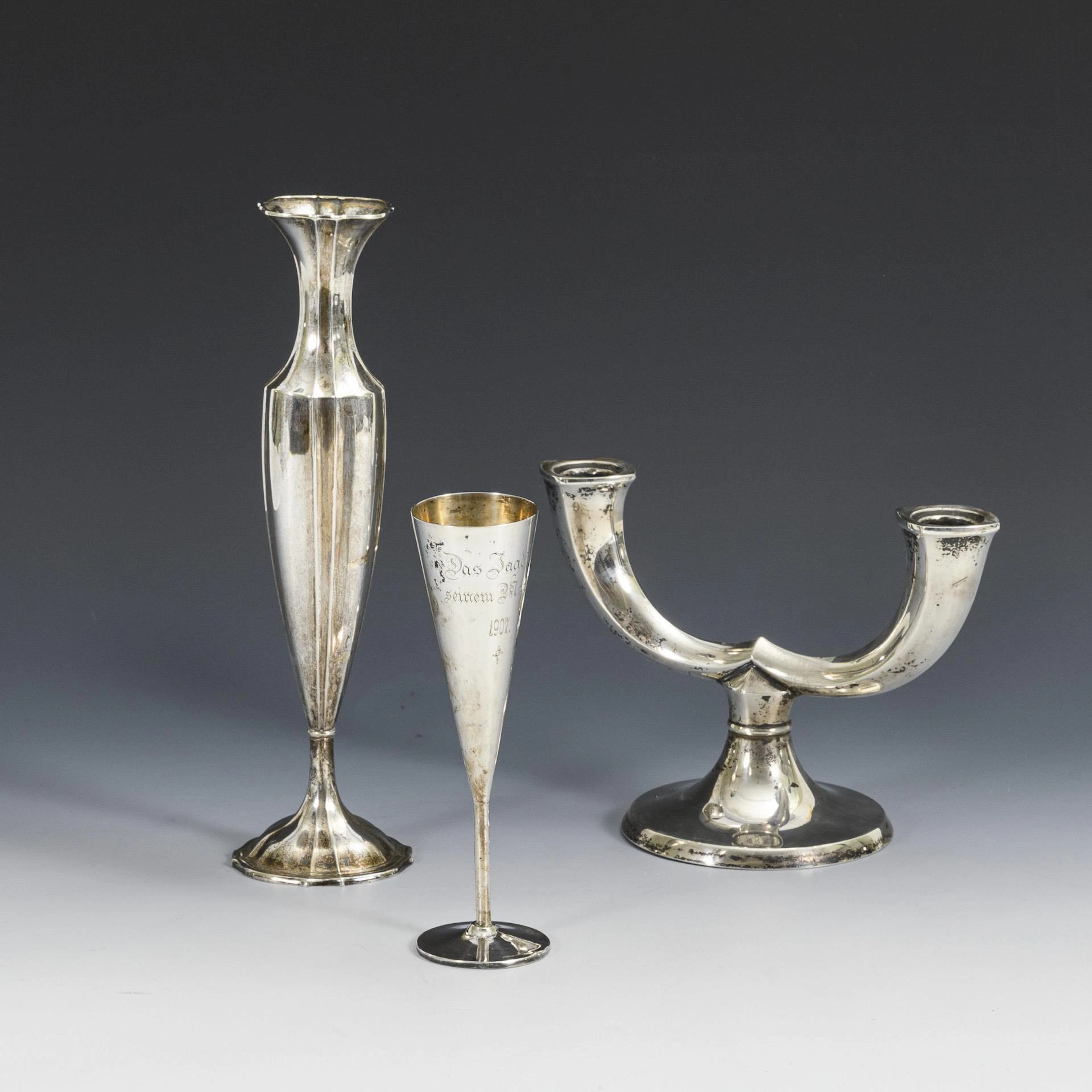Vase, champagne goblet and candlestick, silver.