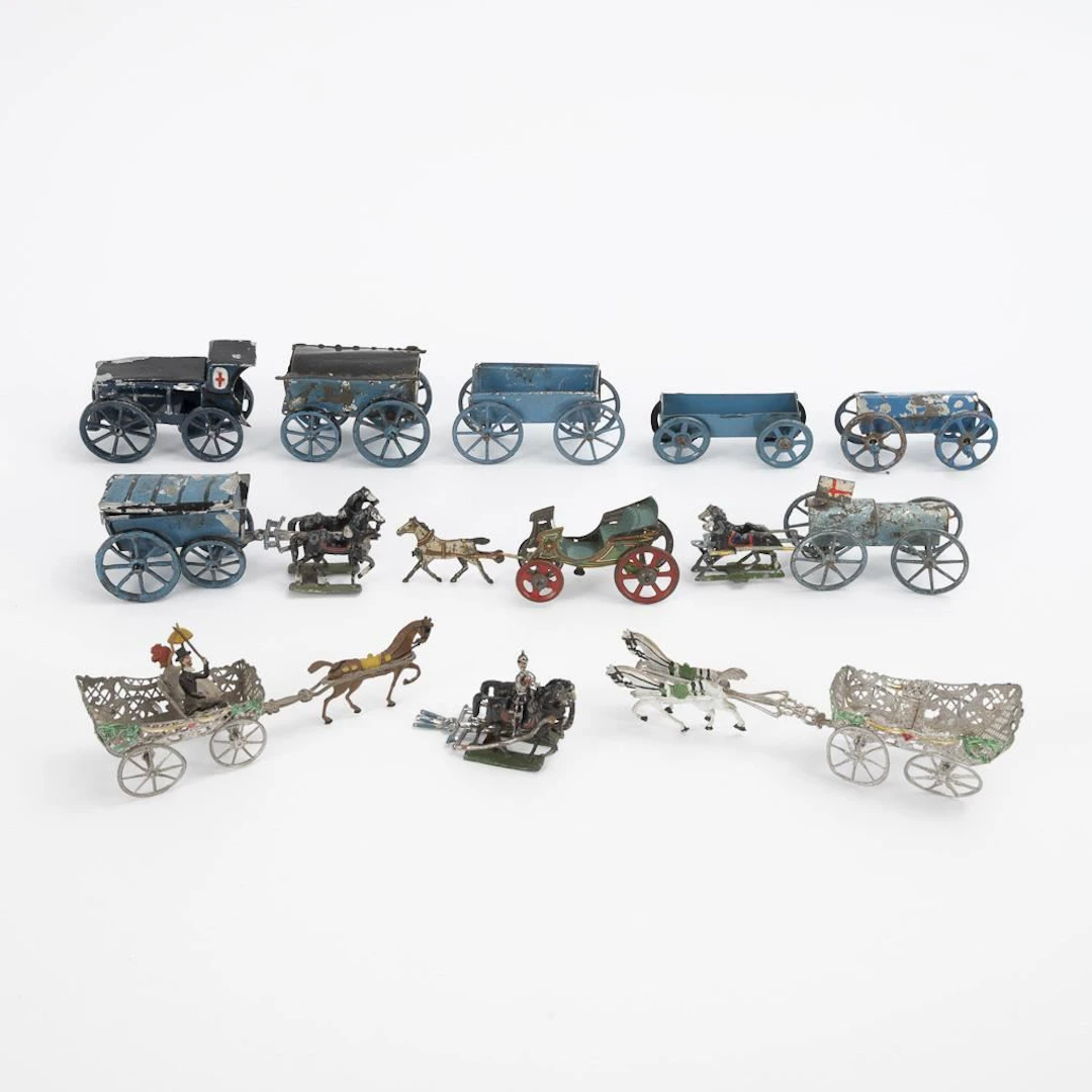 Assortment of metal cars and carriages.