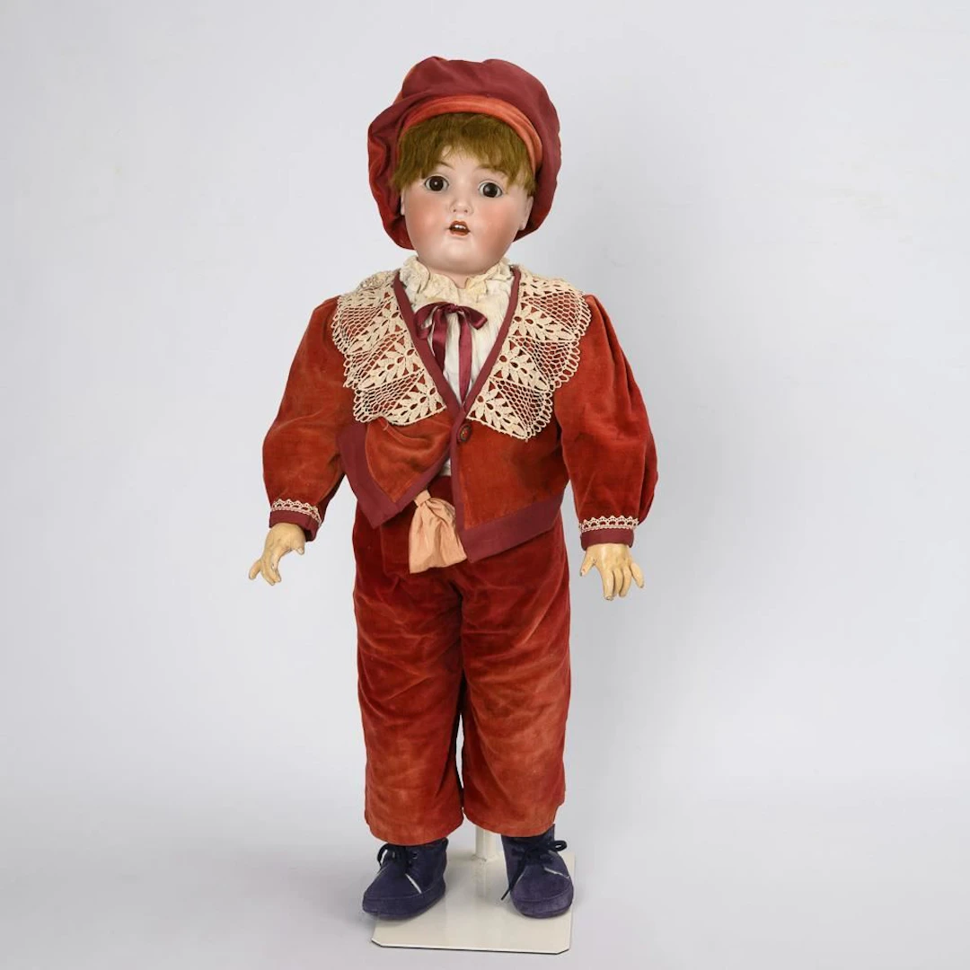 Large boy doll in a red suit. Kestner & Comp.