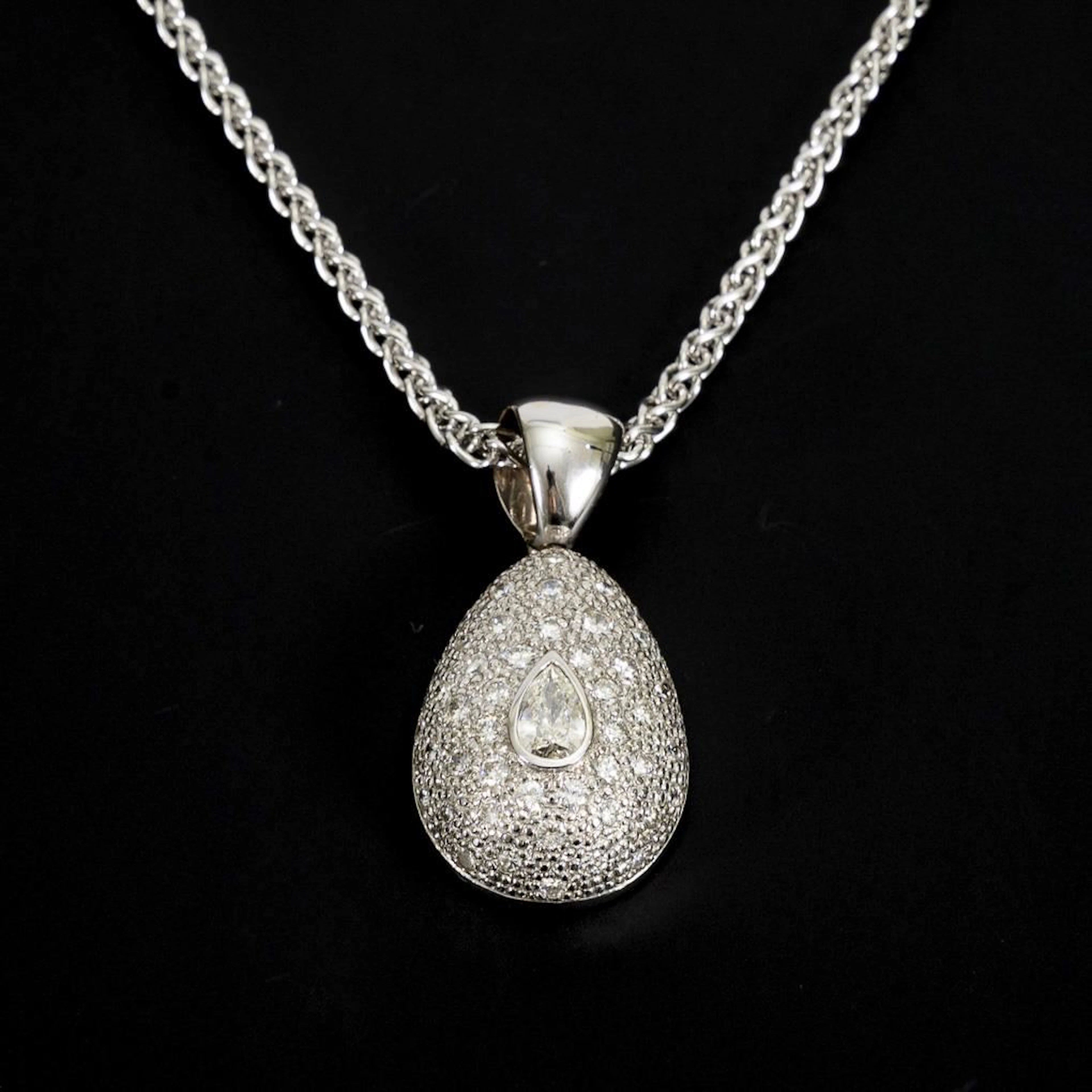 Pendant with a large, teardrop-shaped diamond on a chain.