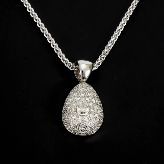 Pendant with a large, teardrop-shaped diamond on a chain.