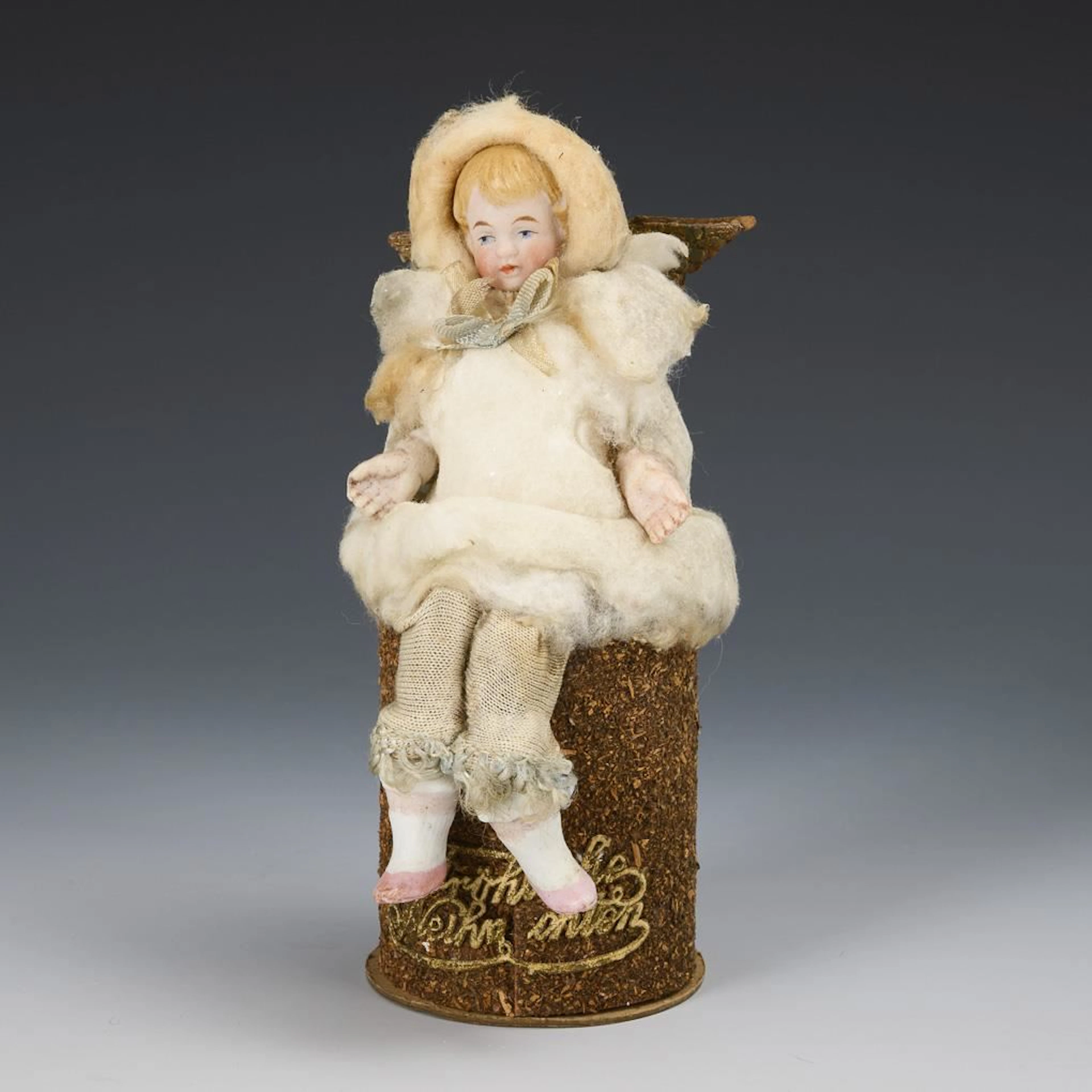 Candy container with cotton wool figure.