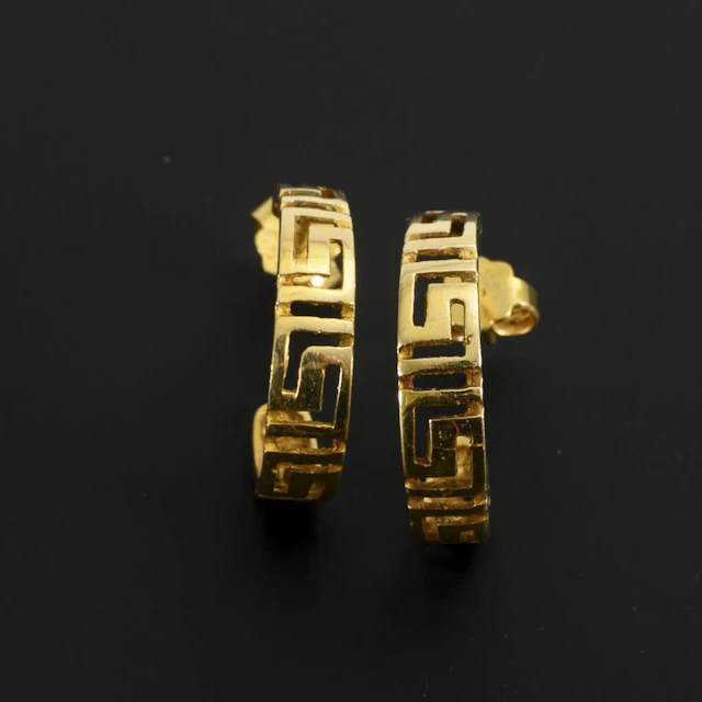 Hoop earrings with a meander pattern.