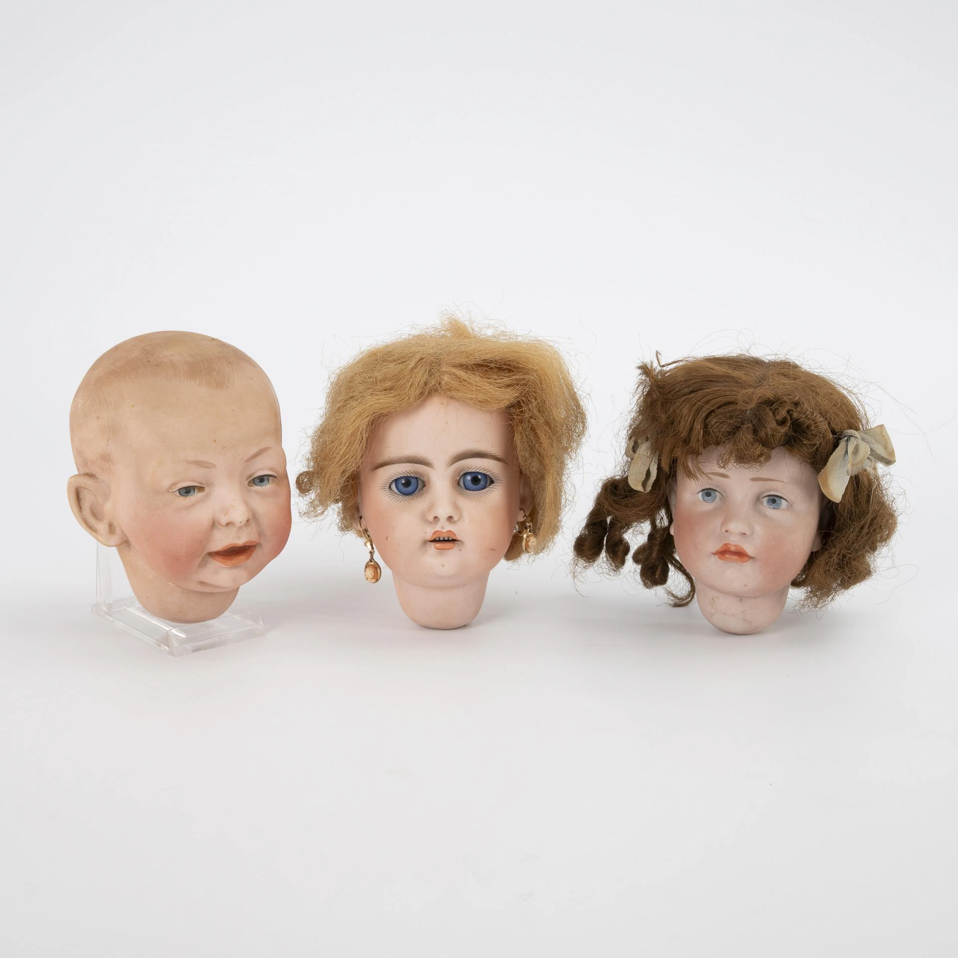 3 doll heads.