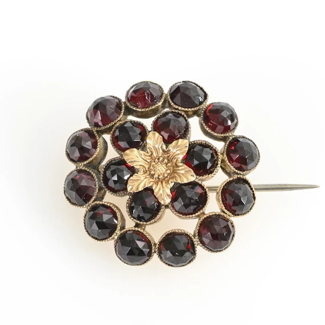 Antique brooch with rose-cut garnets.