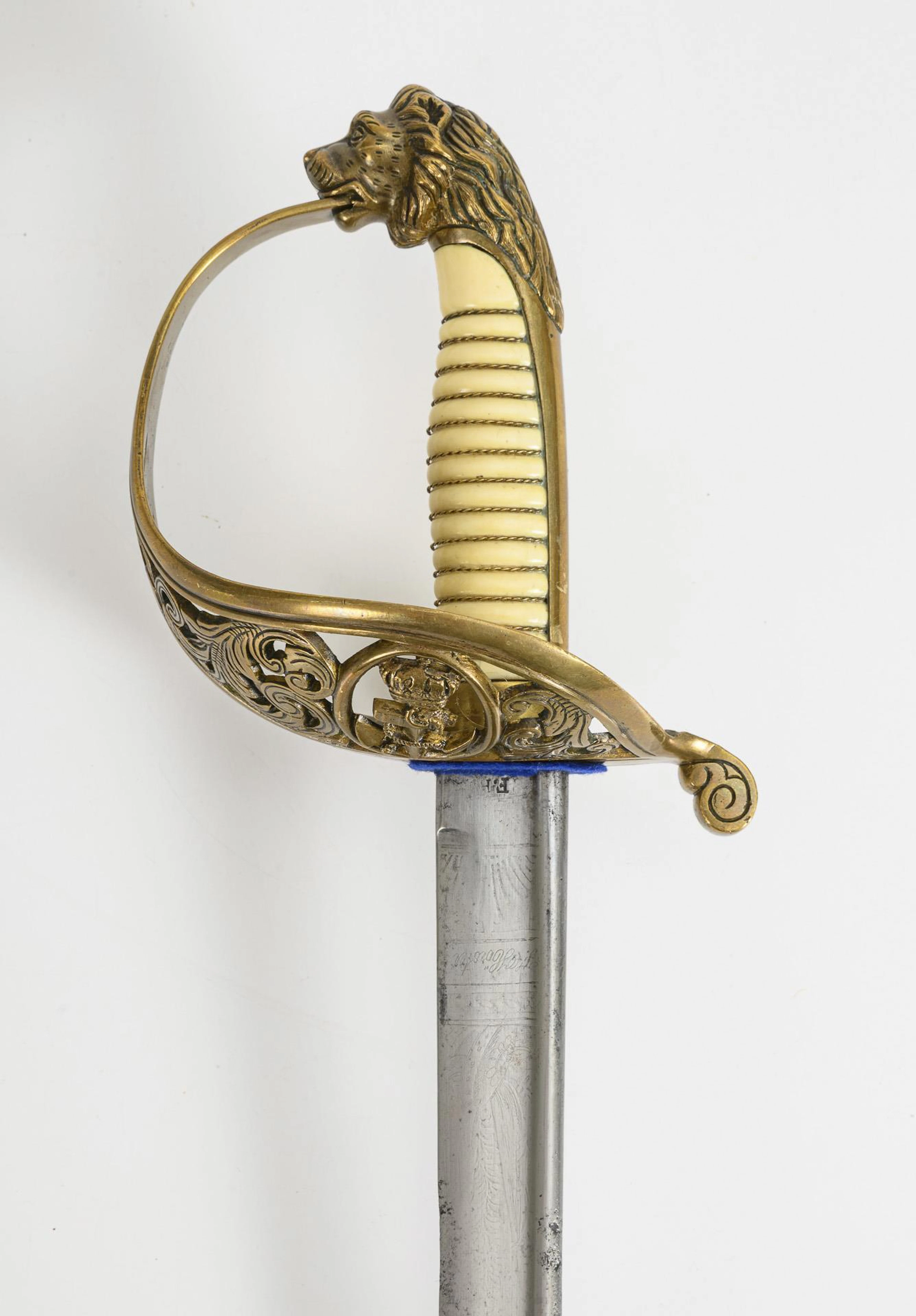 Marine sabre with lion's head pommel.