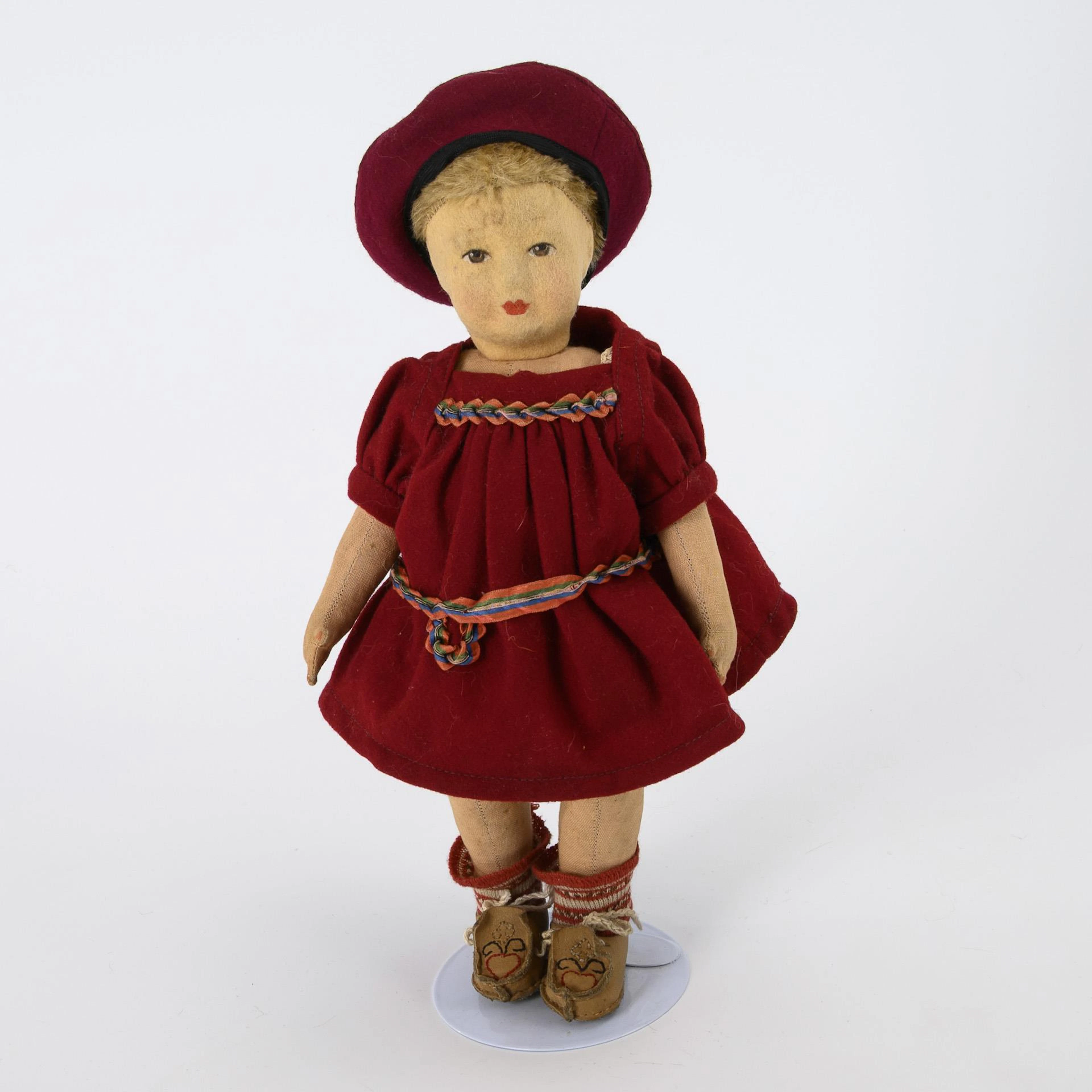 Doll with felt head.