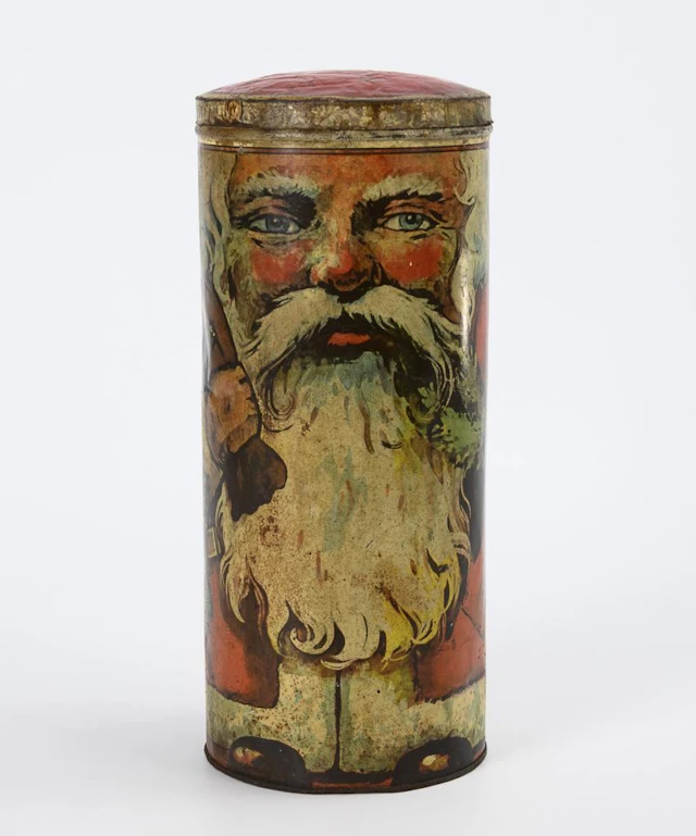 Old tin can featuring Santa Claus.