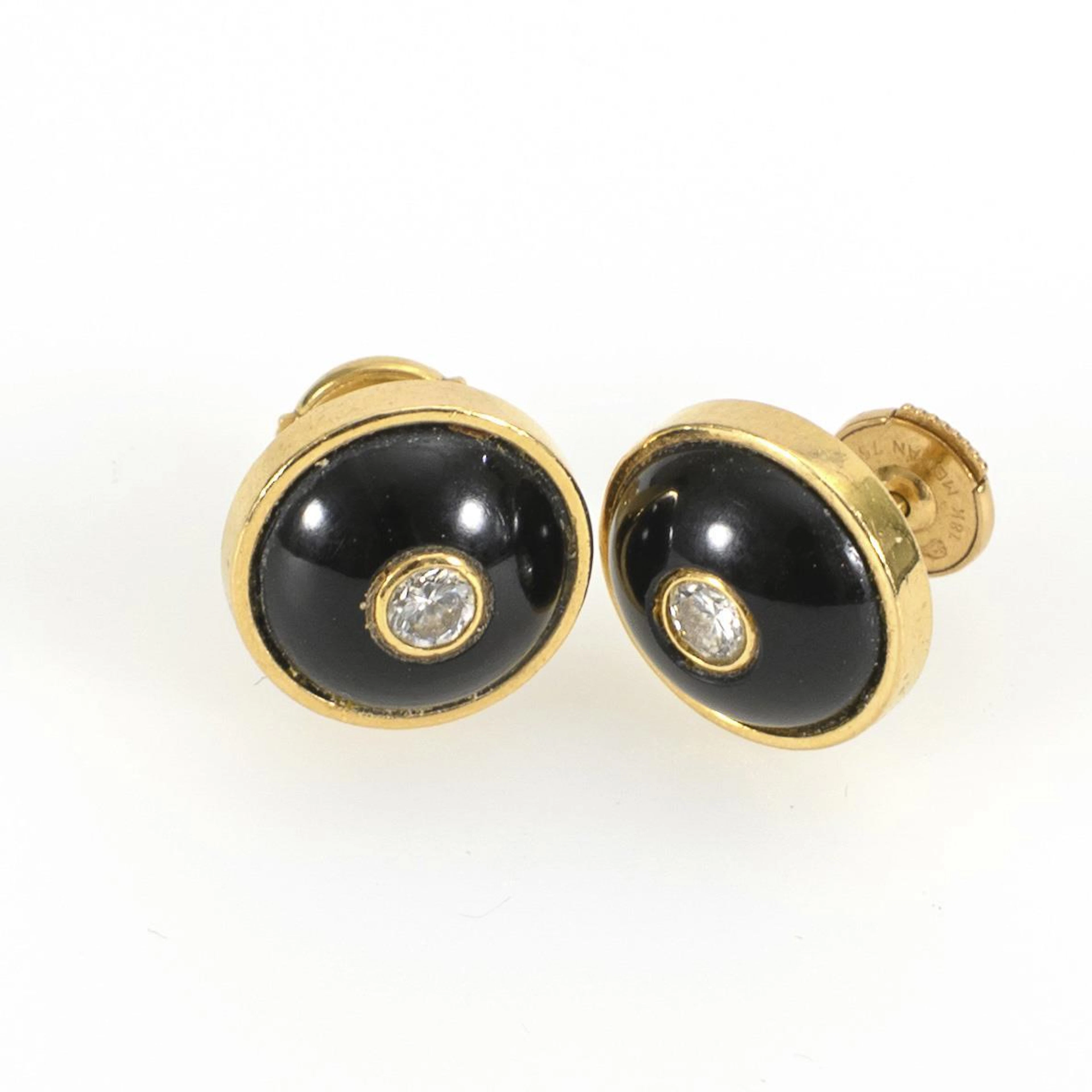 Ear studs with onyx inlays and diamonds.