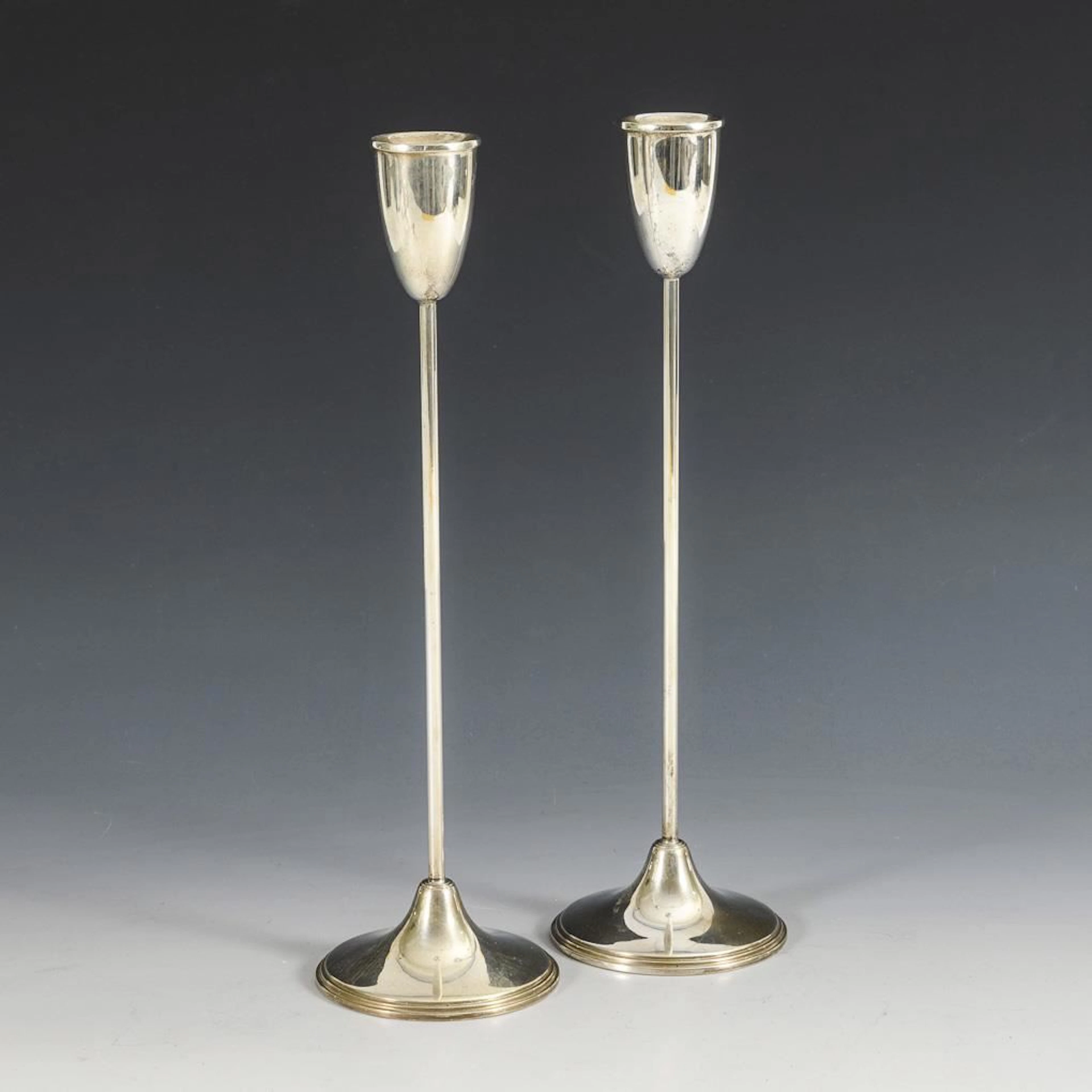 Pair of silver tulip candlesticks.