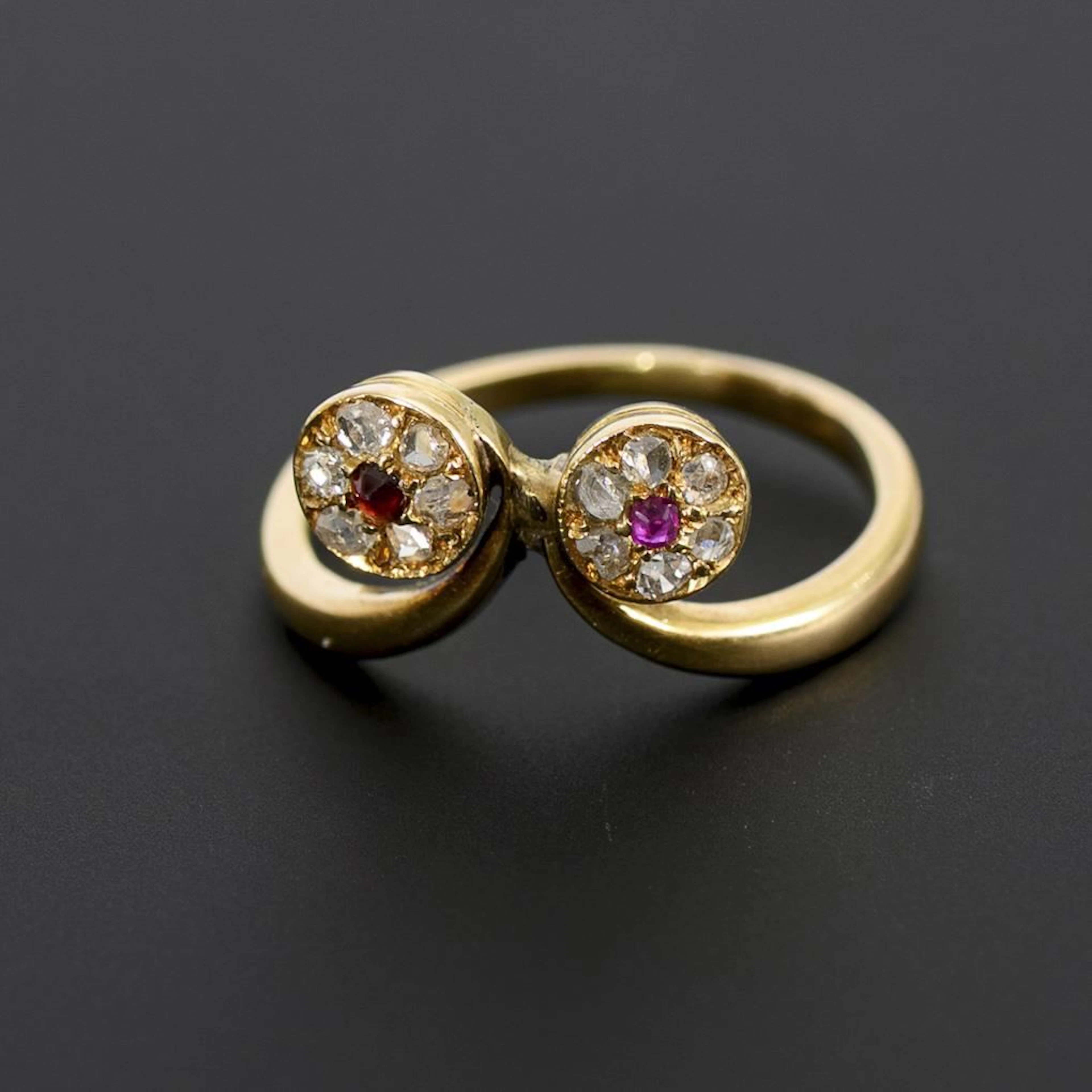 Unusual Art Nouveau ring with red gemstones and diamonds.