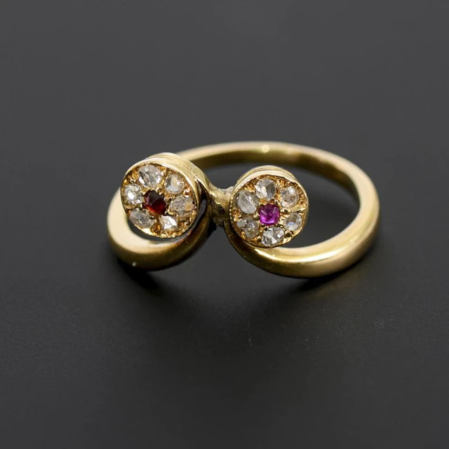 Unusual Art Nouveau ring with red gemstones and diamonds.