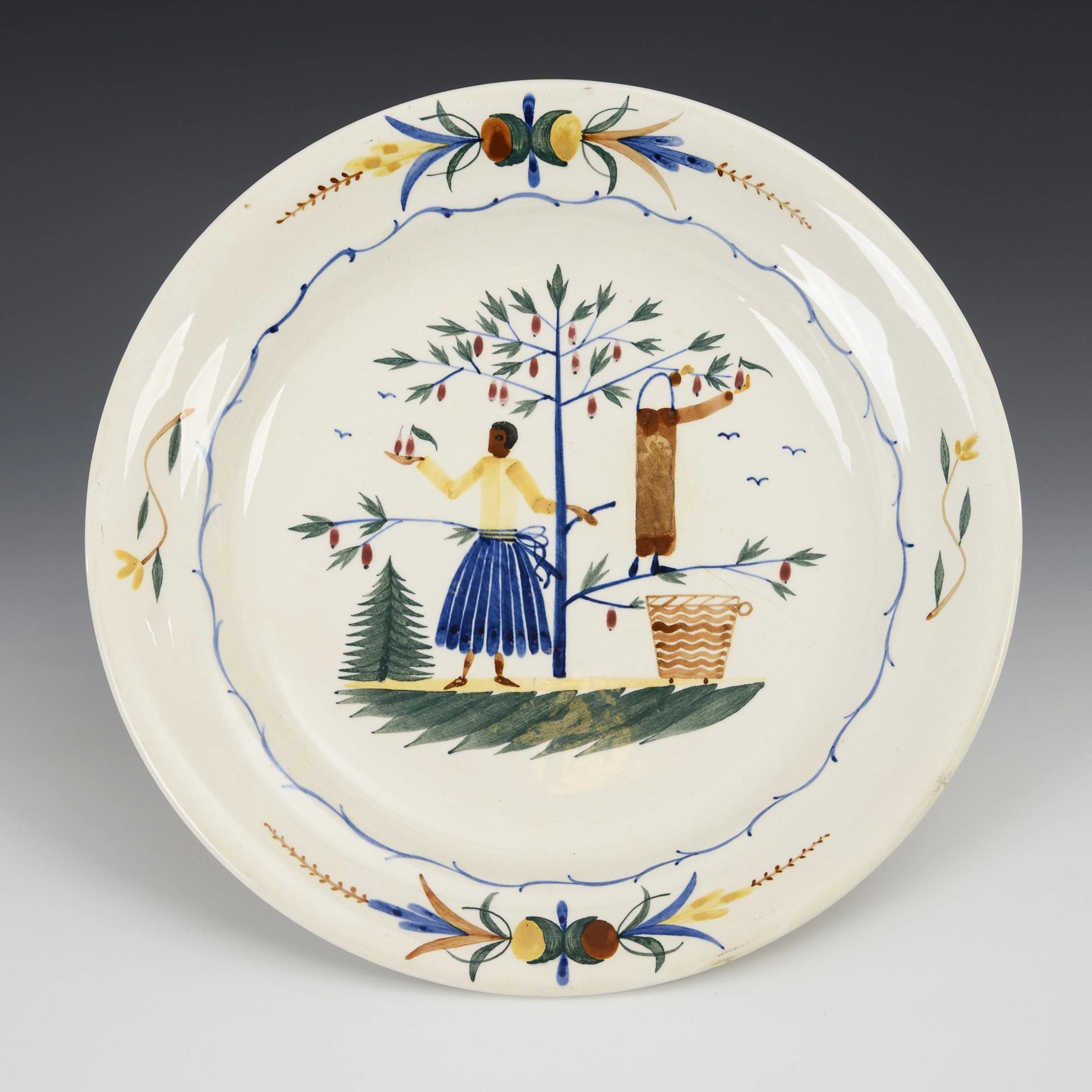 Hand-painted faience plate with figure painting. Steingutfabriken