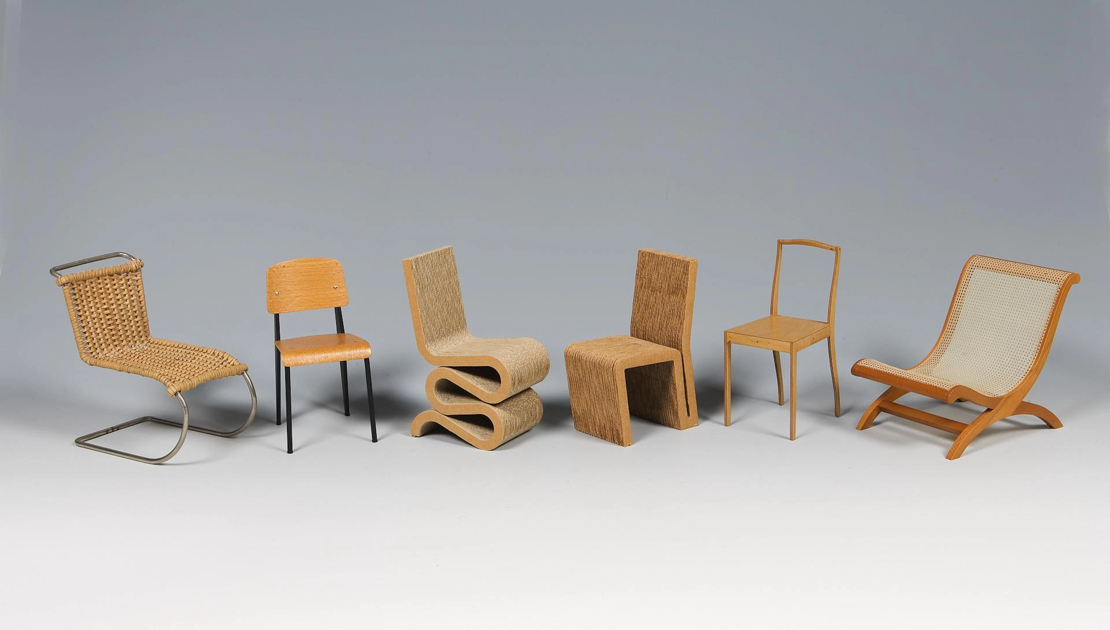 6 miniature design chairs.