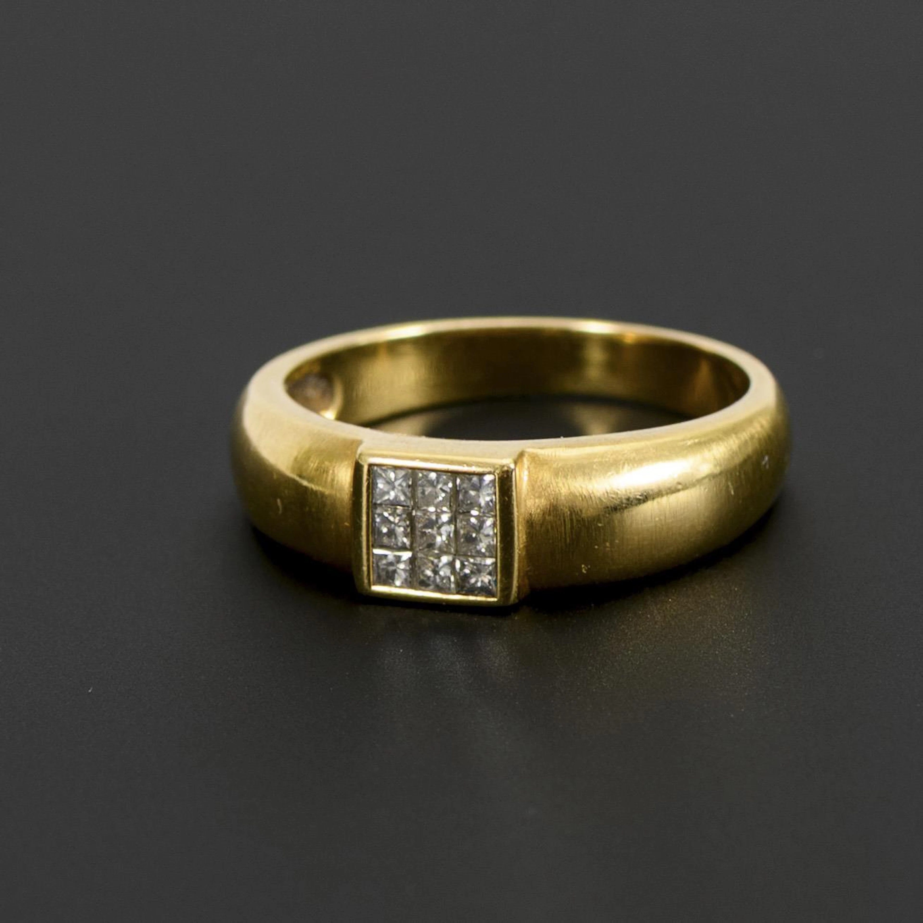 Ring with diamonds.