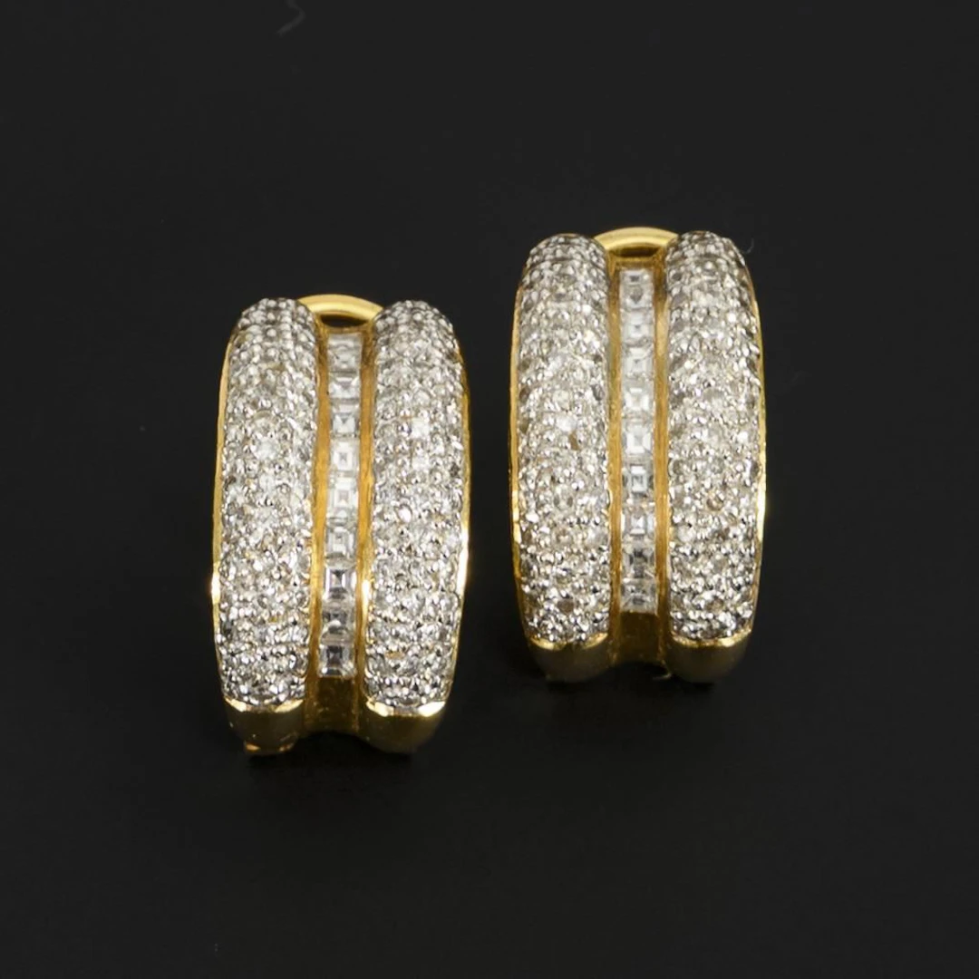 Pair of clip studs with brilliant-cut diamonds and diamonds.