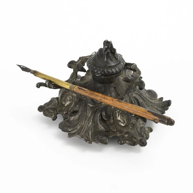 Inkwell with music box.