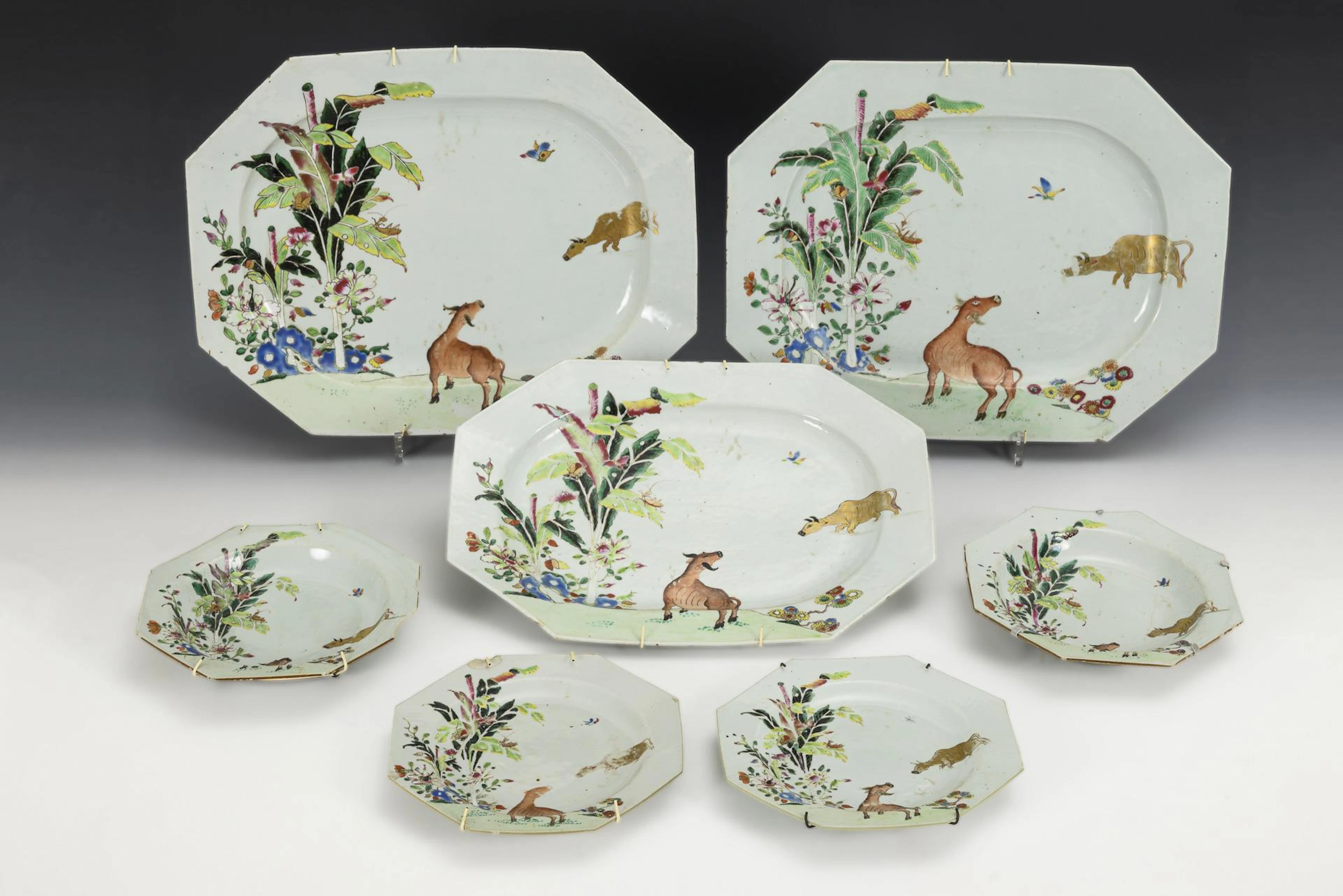 7 square porcelain plates in the same style.