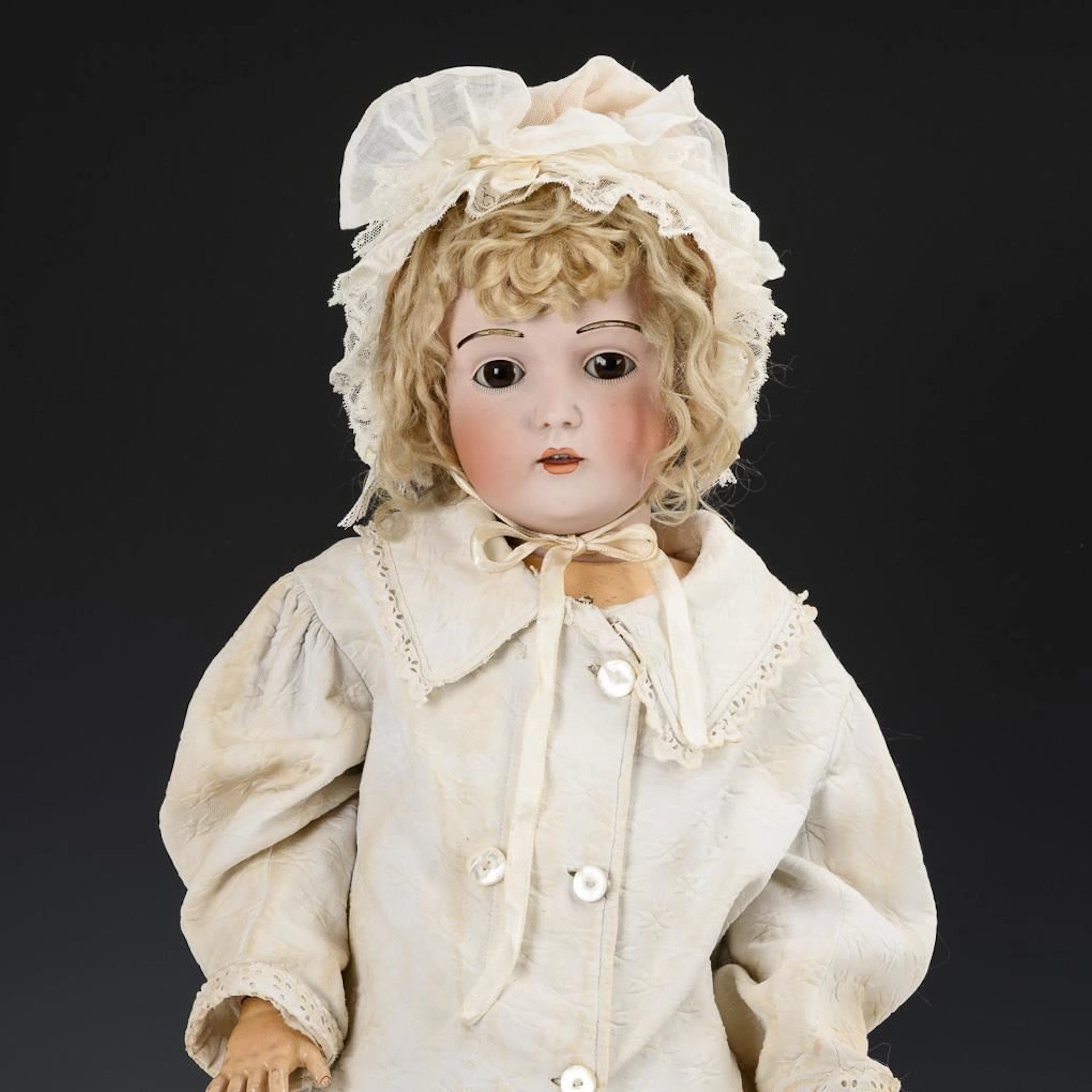 Blonde girl doll with fur eyebrows. J.D. Kestner.