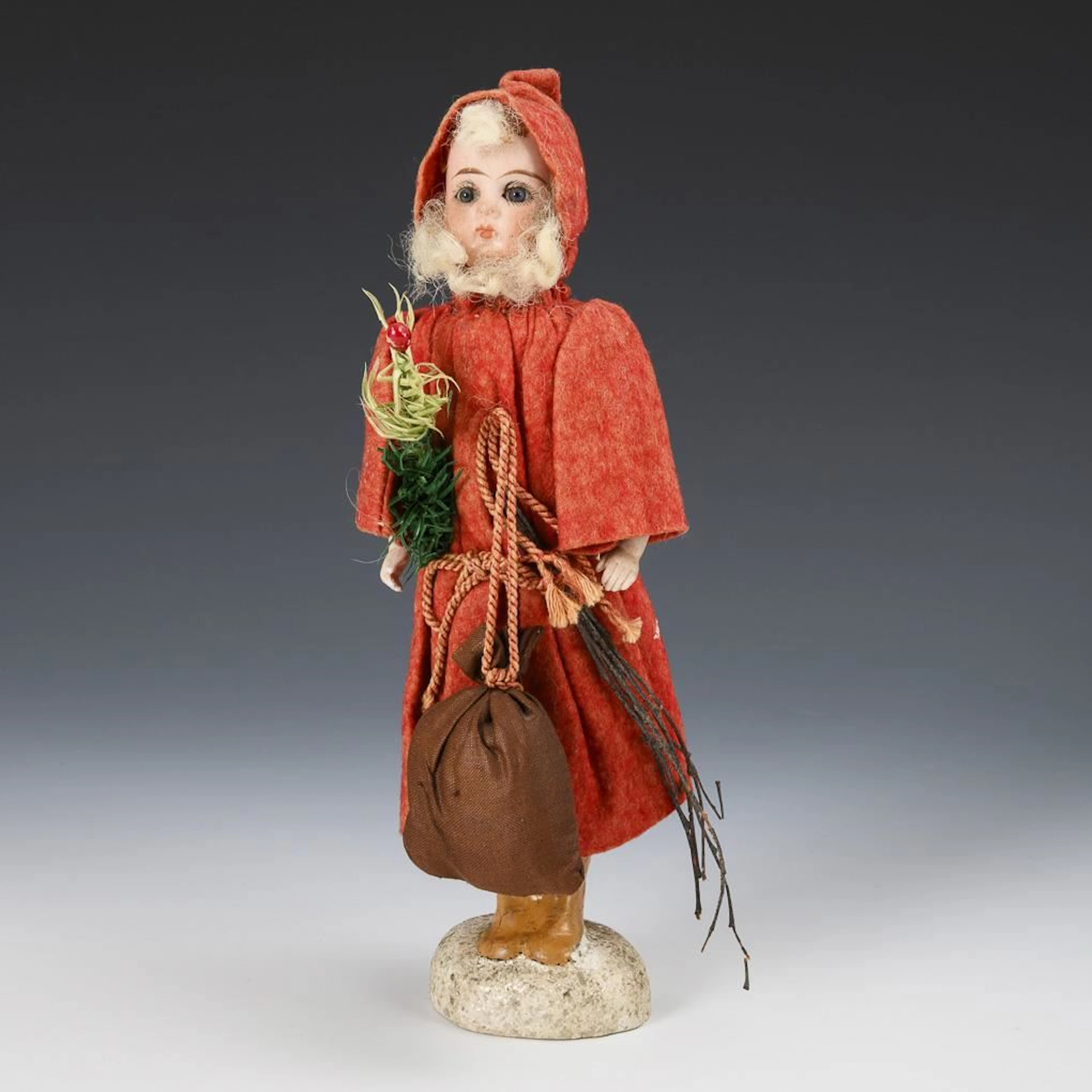 Candy box shaped like Santa Claus with a doll's head.