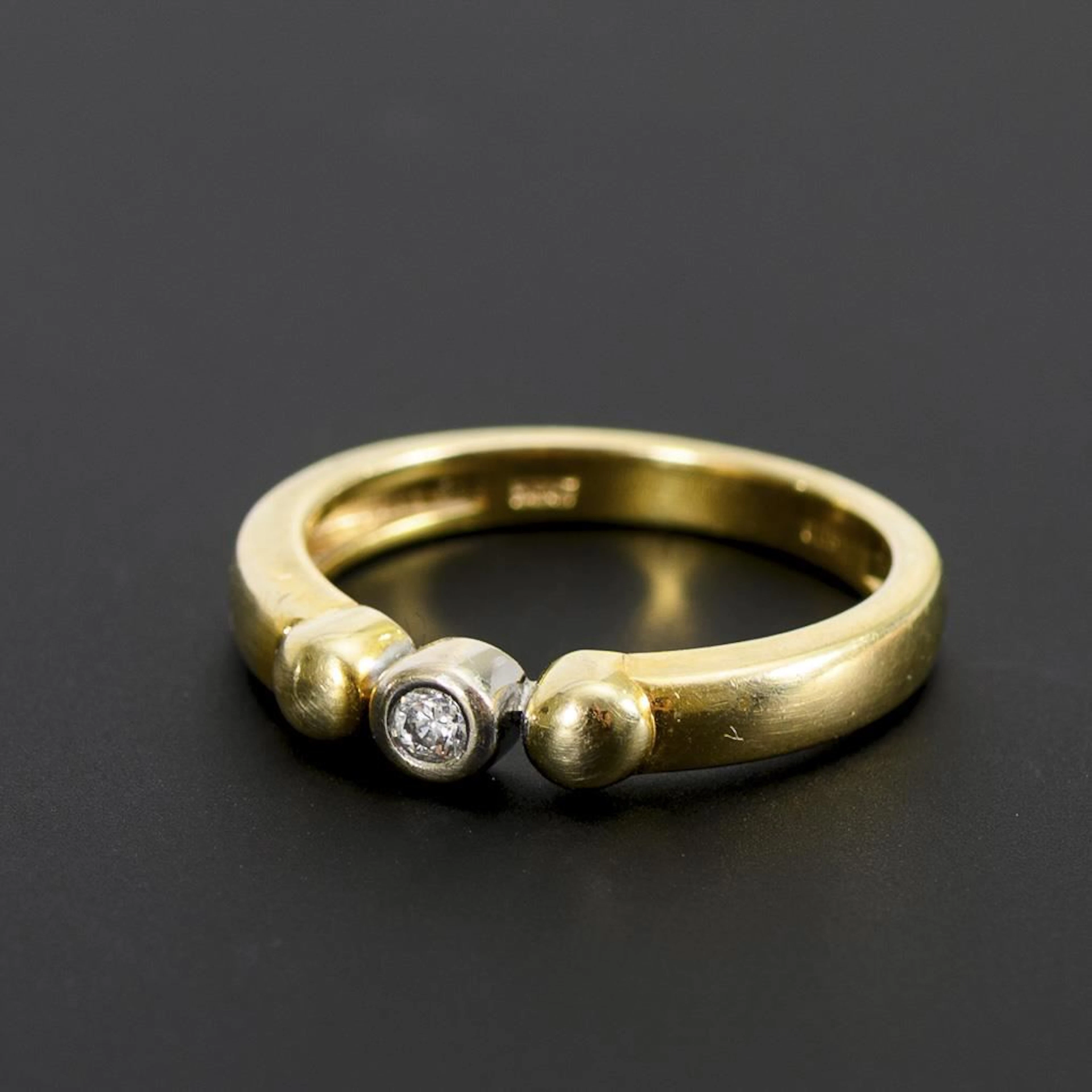 Ring with a solitaire diamond.