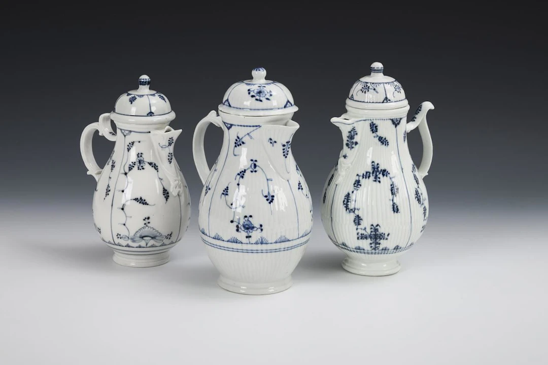 3 Baroque jugs with straw flower designs.