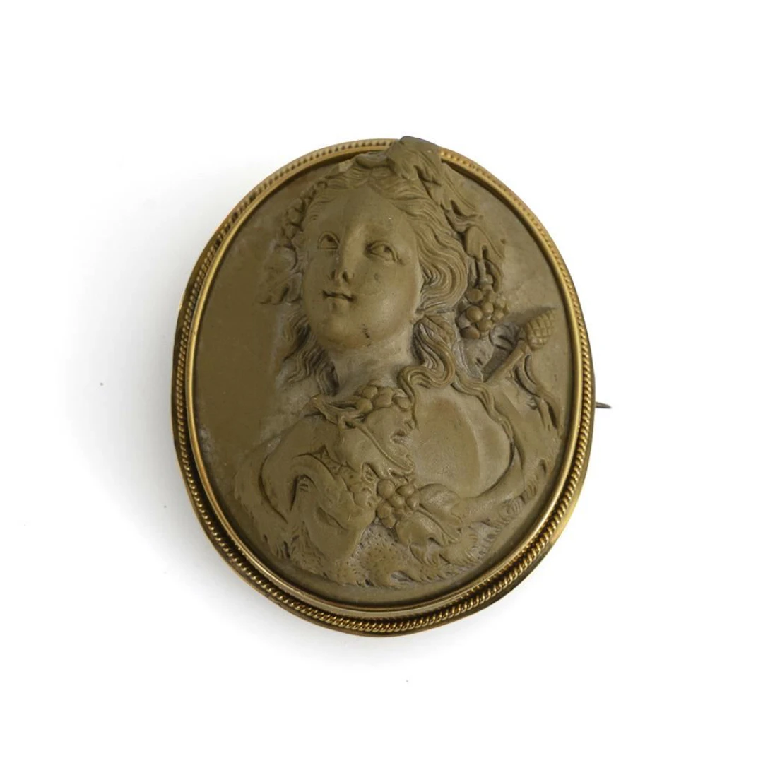 Antique brooch with a lava stone cameo.