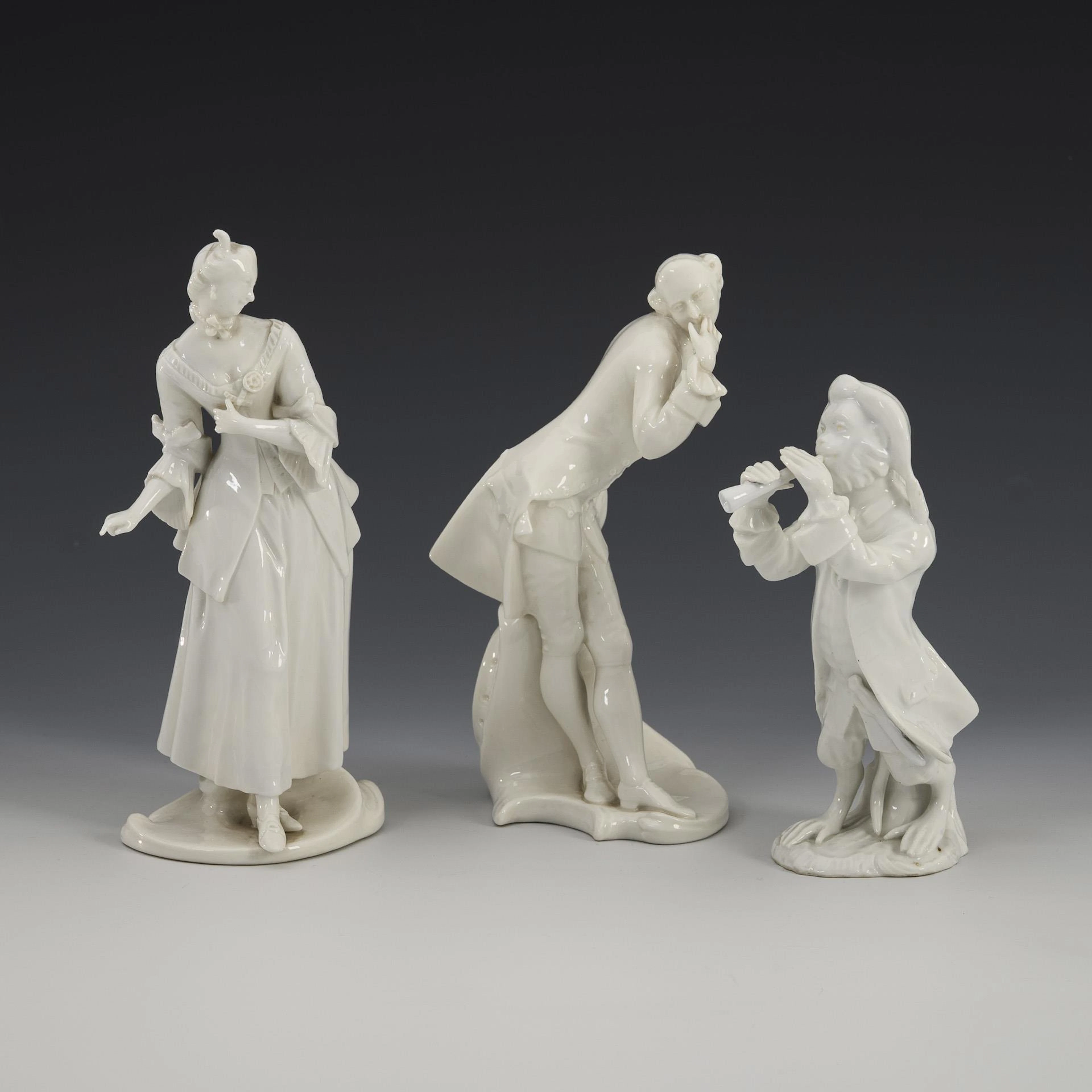 2 commedia dell'arte figures and 1 monkey musician.