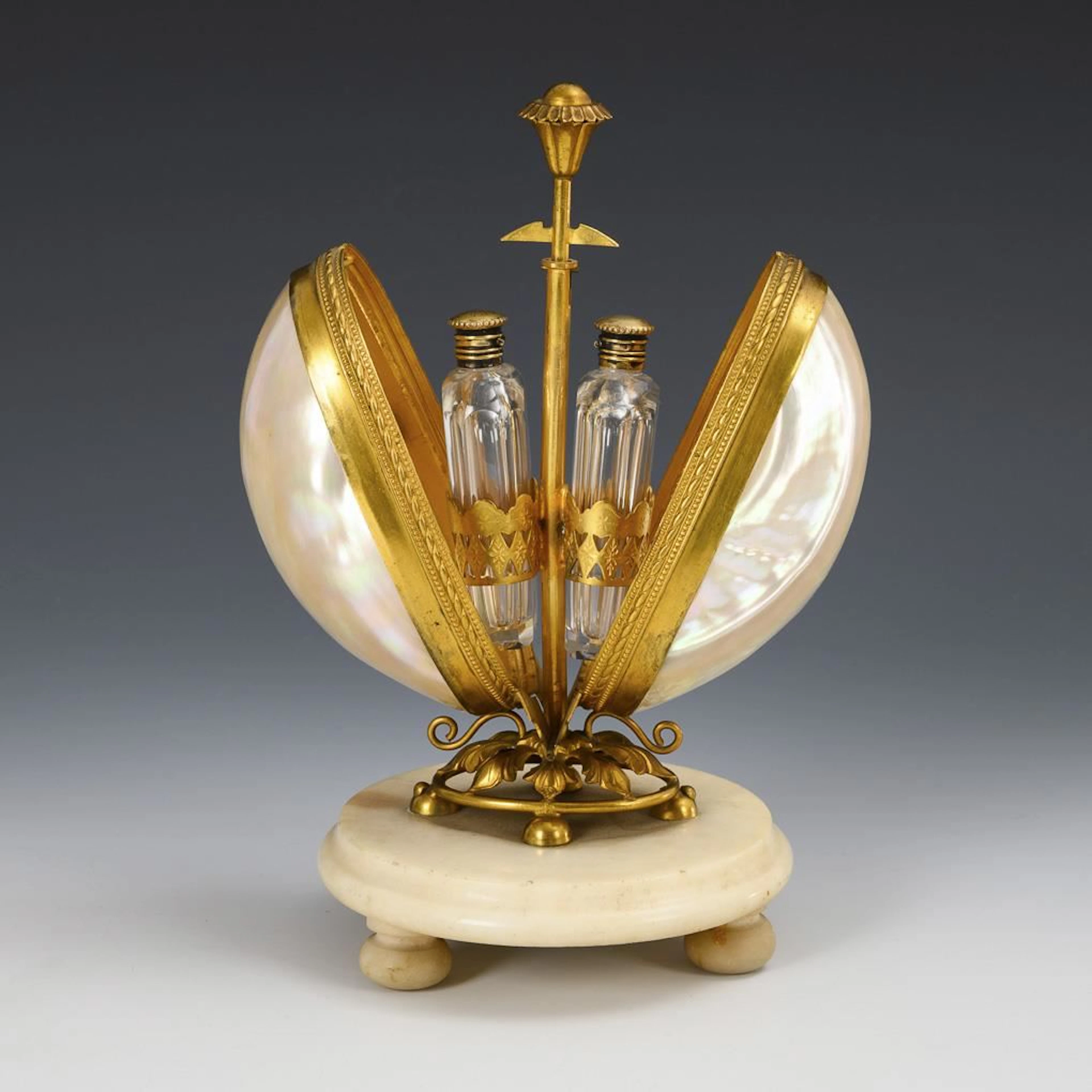 Egg-shaped container for perfume bottles.