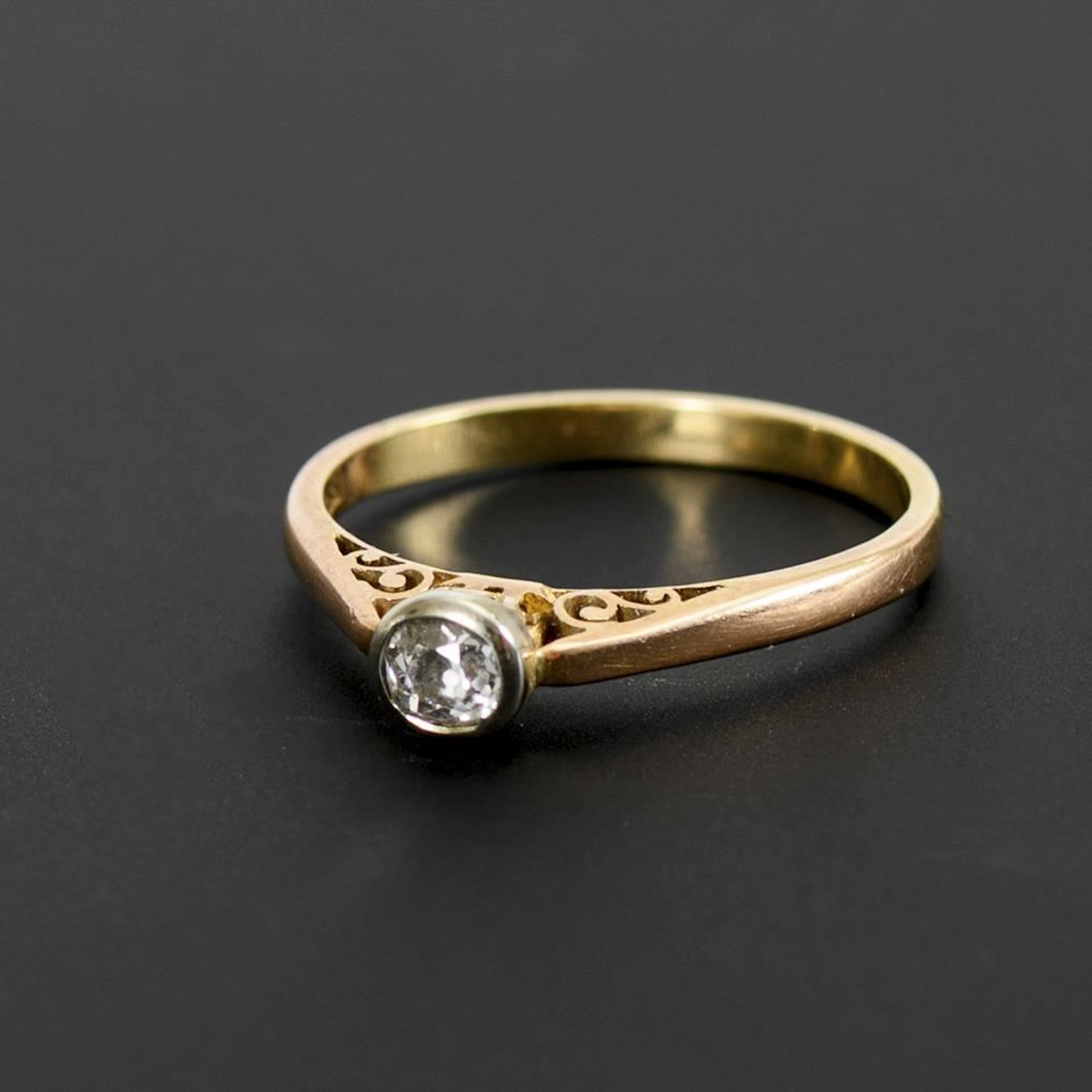 Ring with an old-cut solitaire.