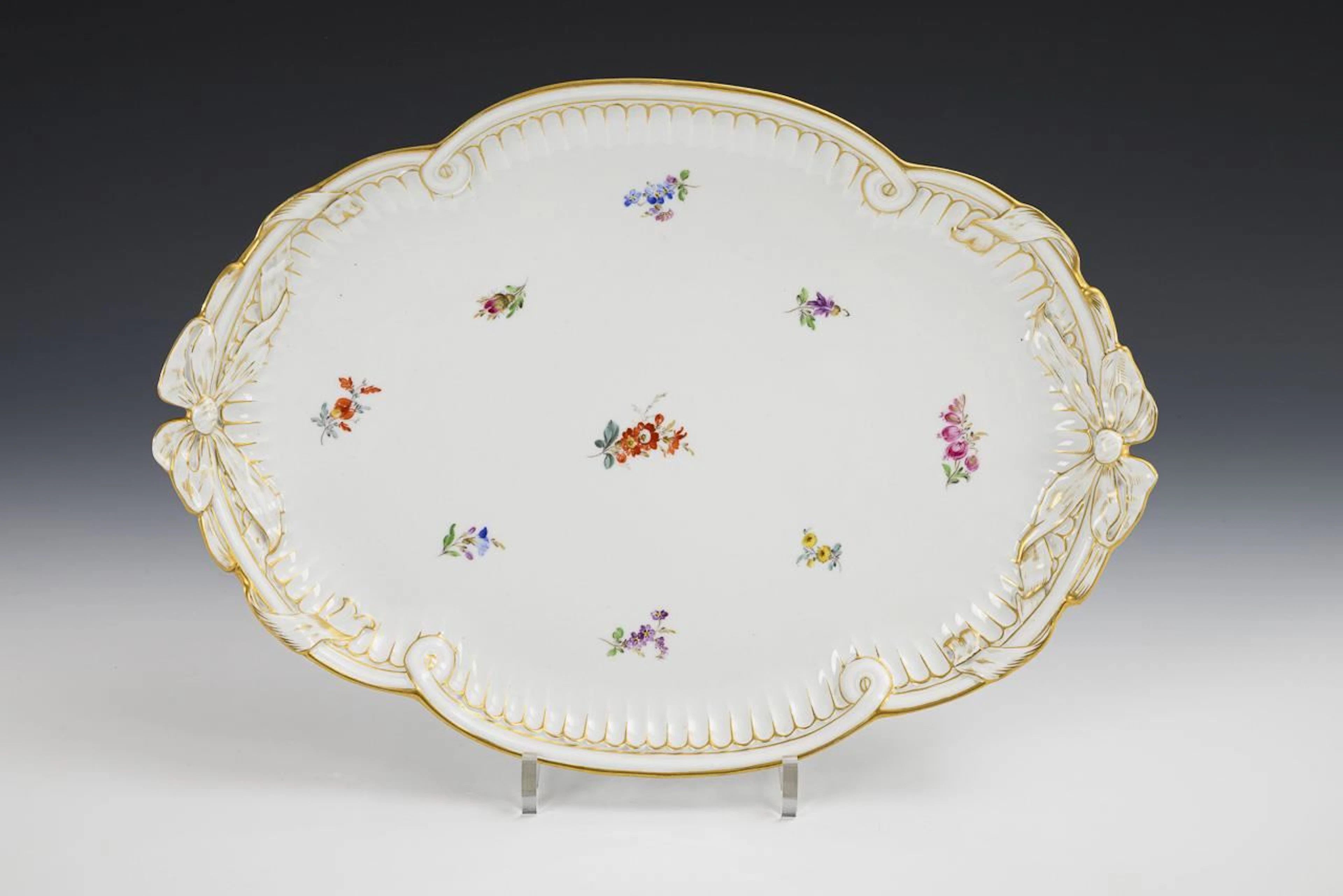 Oval plate with loop handles and scattered flower design. Meissen.