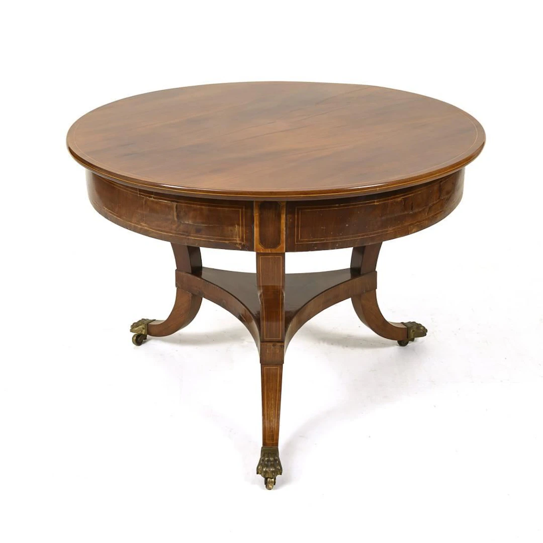 Round Biedermeier table on casters.